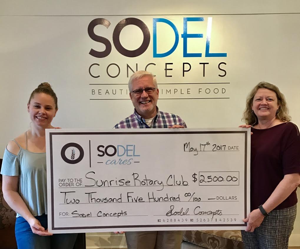  SoDel Cares, the philanthropic arm of SoDel Concepts, a hospitality group with 10 restaurants, recently donated $2,500 to Rehoboth Beach Sunrise Rotary Club. Lindsey Barry (left), the controller for SoDel Concepts, presents the check to rotary members Ray Bryant and Donna Winegar.