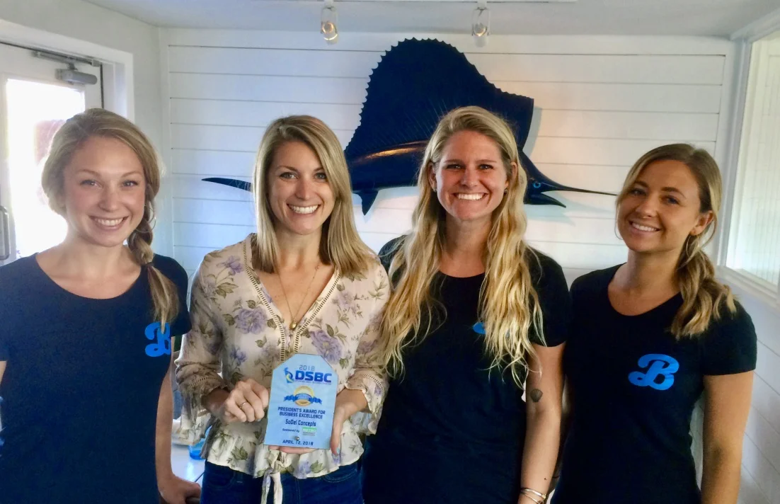 PHOTO: SoDel Concepts recently received the President’s Award for Business Excellence from the Delaware Small Business Chamber. Shown with the award at Bluecoast Seafood Grill + Raw Bar in Bethany Beach is (L. to R.) Chelsea Brown, server; Jess Braun, general manager; Lauren Larson, bar manager; and Sarah Shoemaker, server.