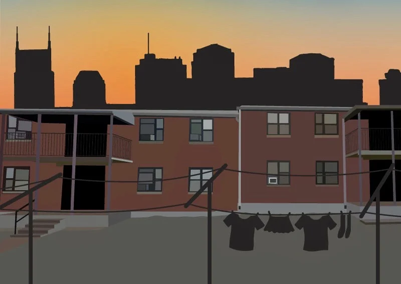 Silhouetted city skyline with tall buildings on the horizon at sunset, view from an apartment complex with laundry hanging on clotheslines in the foreground.