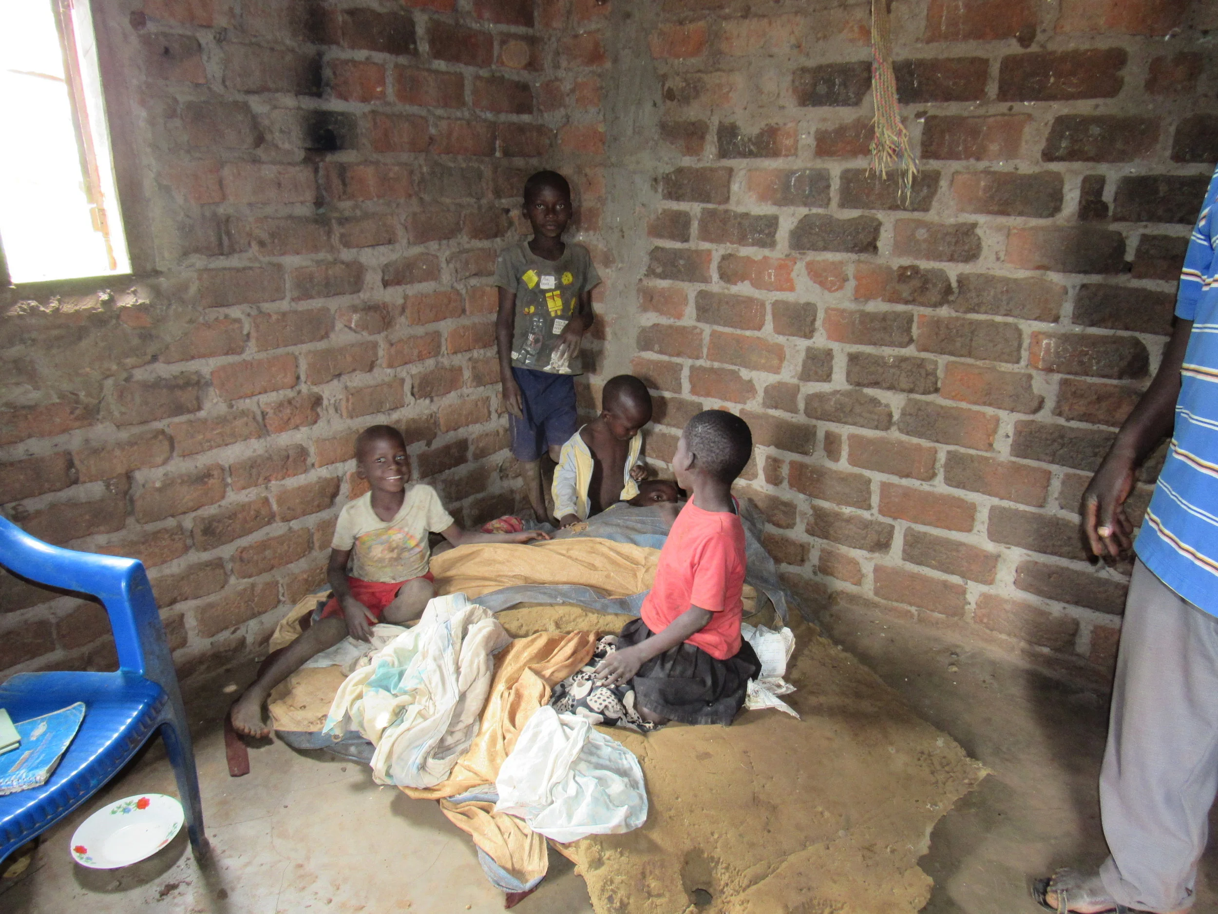 One plastic chair for furniture, filthy mattresses & blankets, a recipe for illness