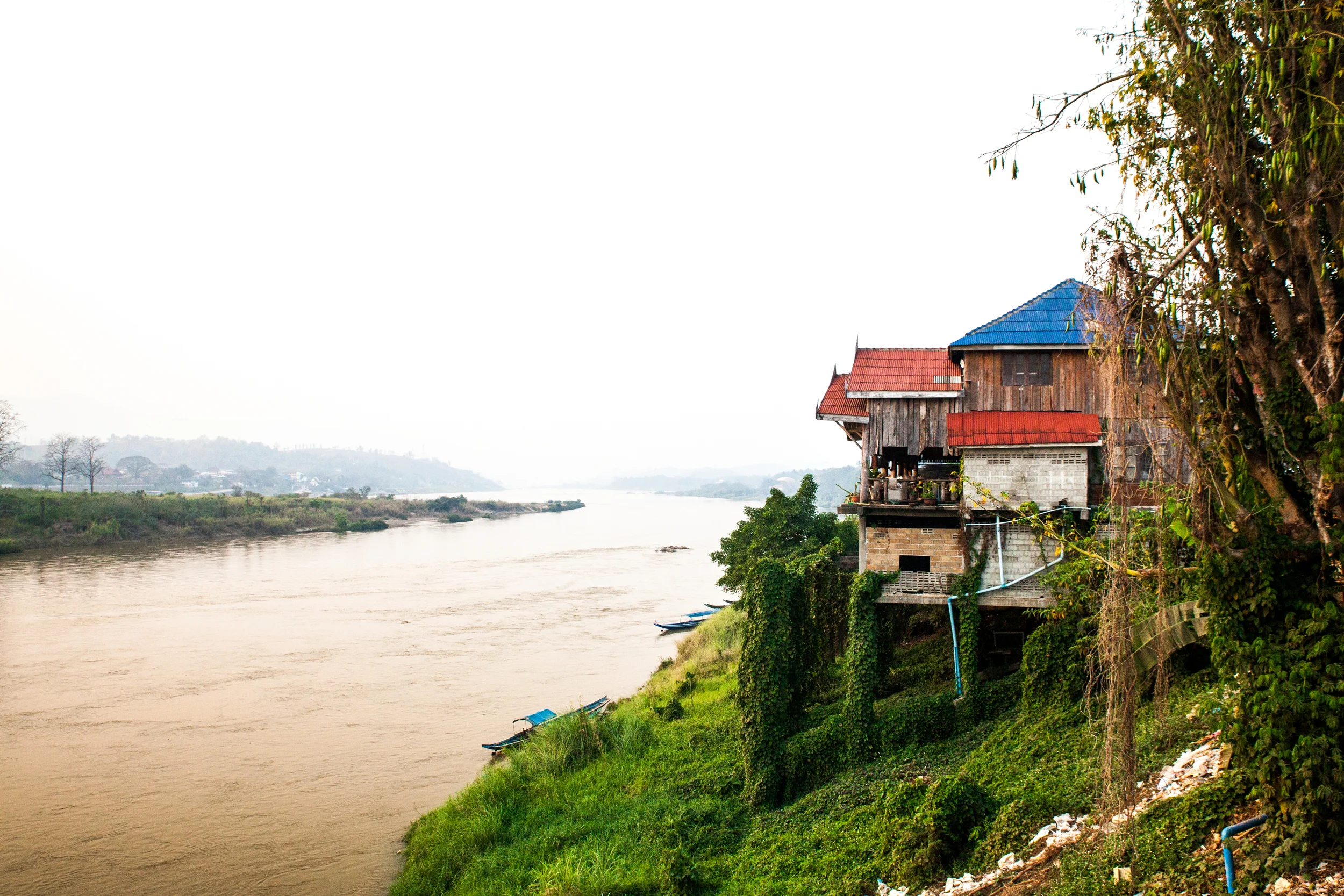A view from the tavern, looking at a neighboring tavern. Below is the Mekong river, the opposing bank is Thailand.