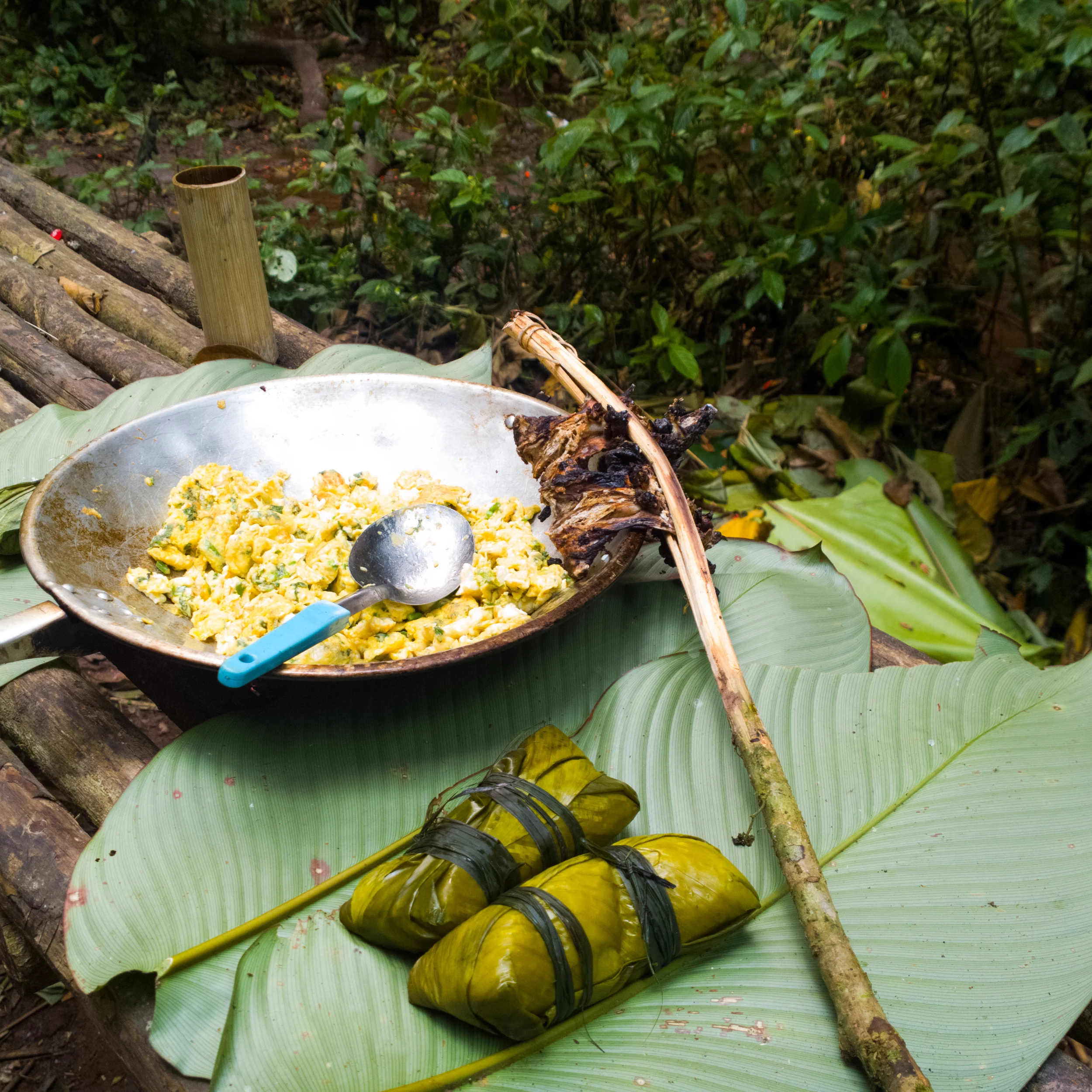 A couple packets of sticky rice wrapped in banana leaf, scrambled eggs, and some delicious.... rats. 