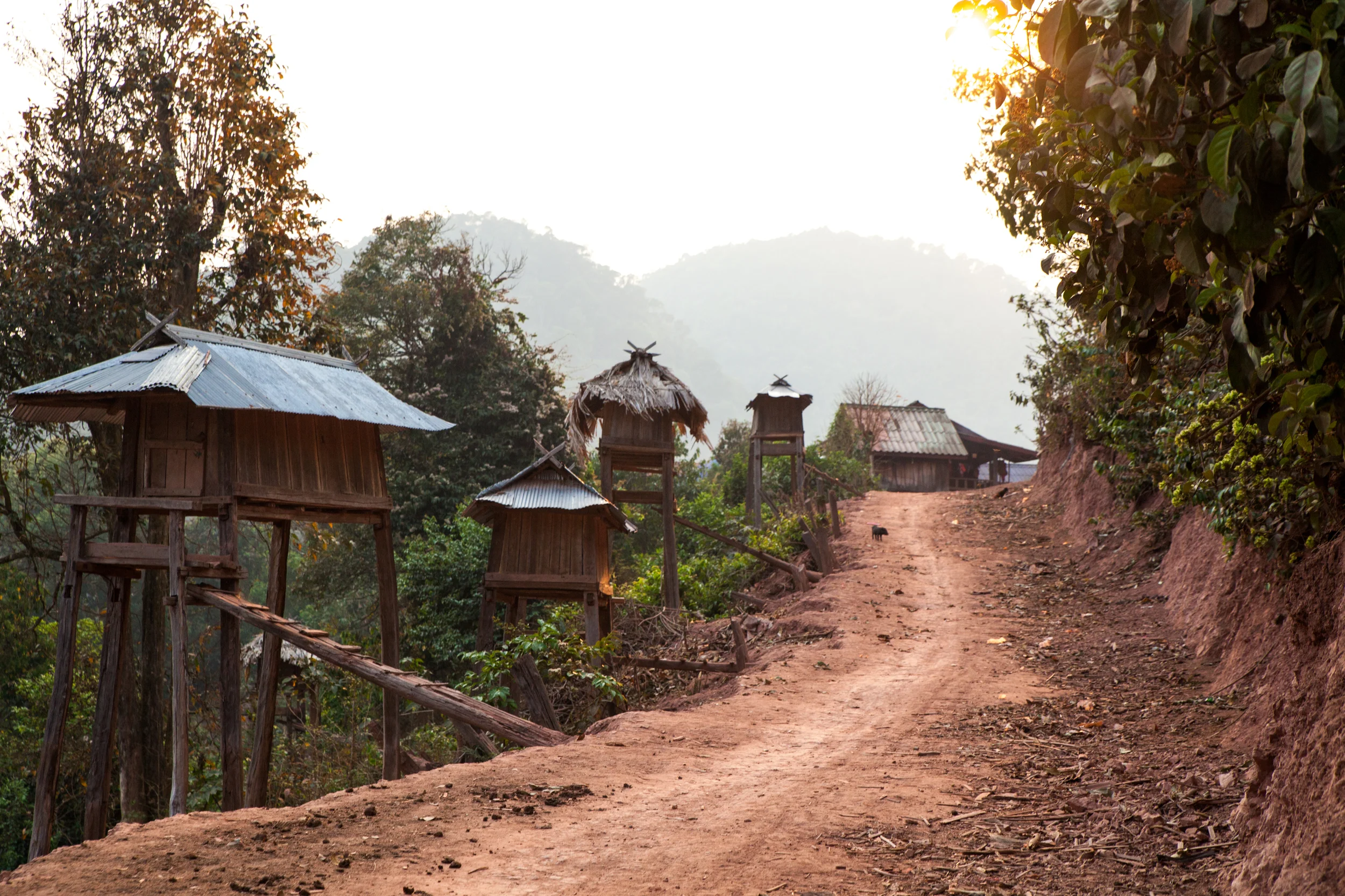 I called this road "Bachelor Row", these little huts are home to young men from other villages that are searching for a wife. They build these homes, that literally are just big enough to sleep in, and from what Xiong told me, just chase after women until they are lucky enough to marry one. As the sun set the young men sat on the little stoops with a light on, doing their hair and straightening their shirts in a small mirror.