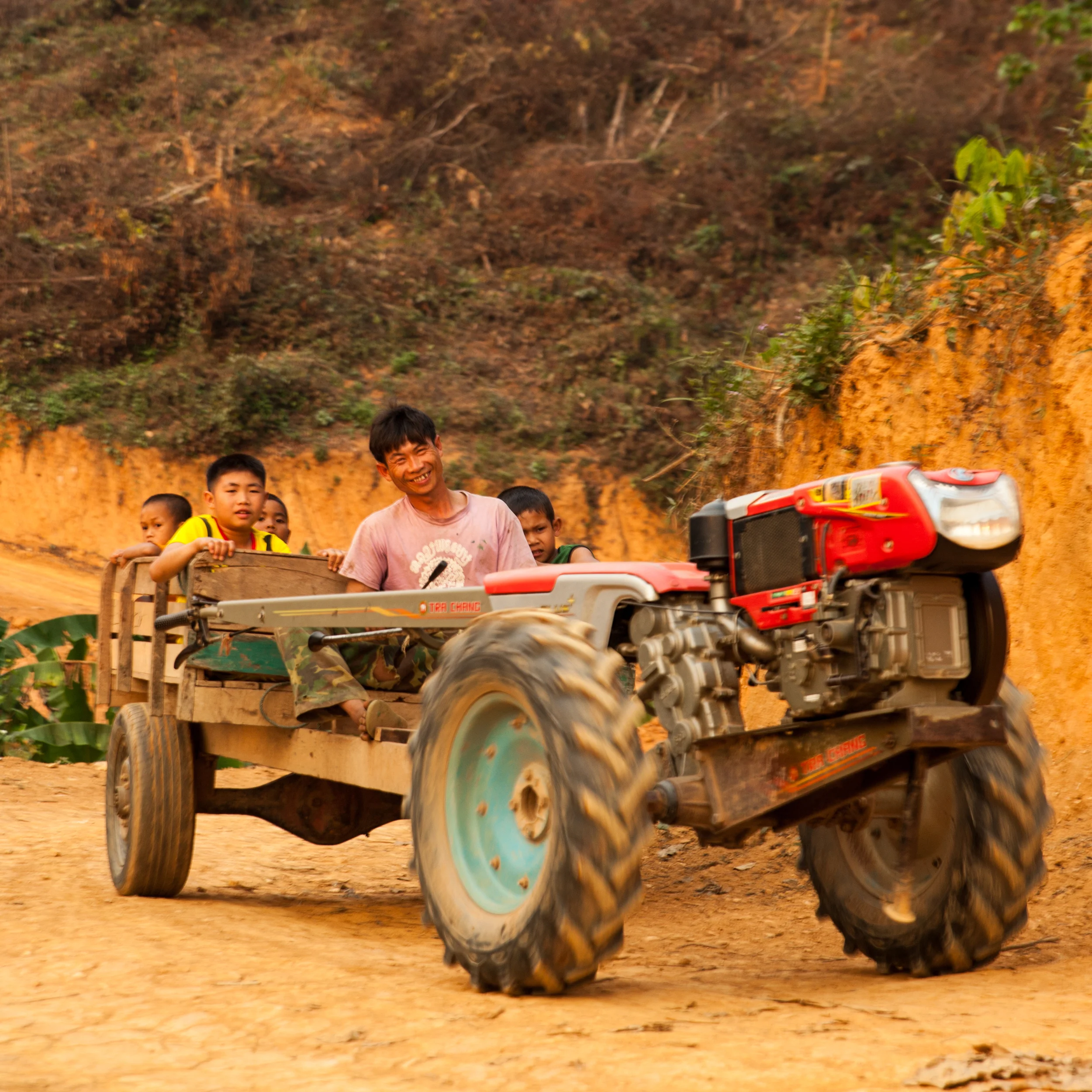 Some friendly people out on the trail. This is the most literal translation of a "horseless carriage" I have ever encountered. They were common throughout northern Laos.