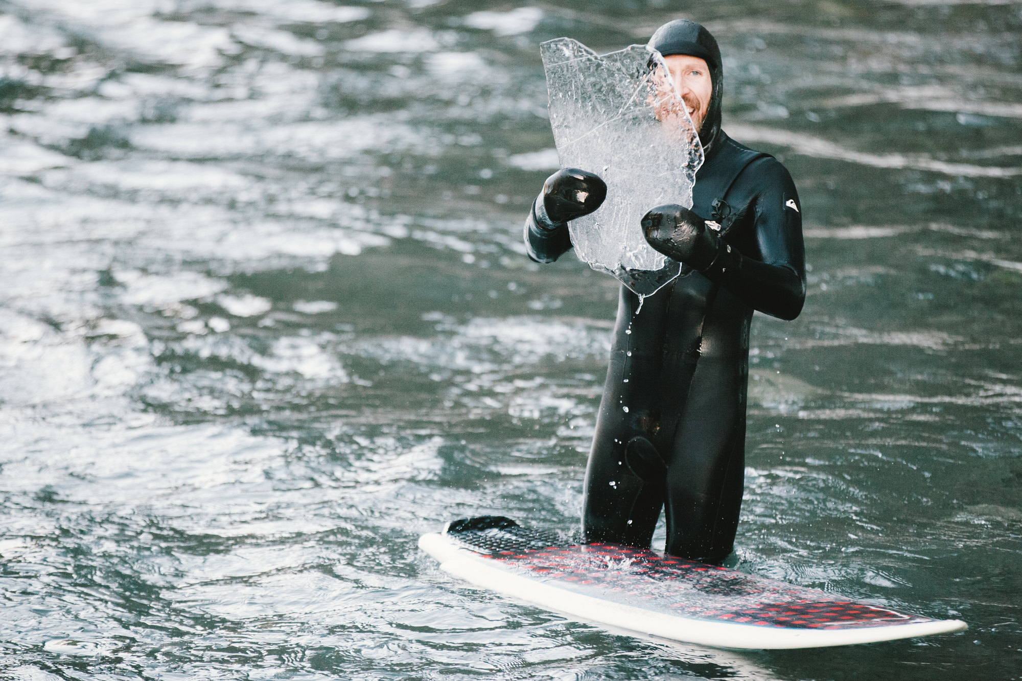 Showing off a piece of ice that has floated down river.