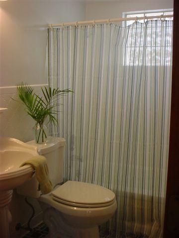 This house was for sale so a budget renovation was done. We replaced the sink and commode. Electrostatic painted the tub. Etched the wall tile and painted. Put LVT on the floor.