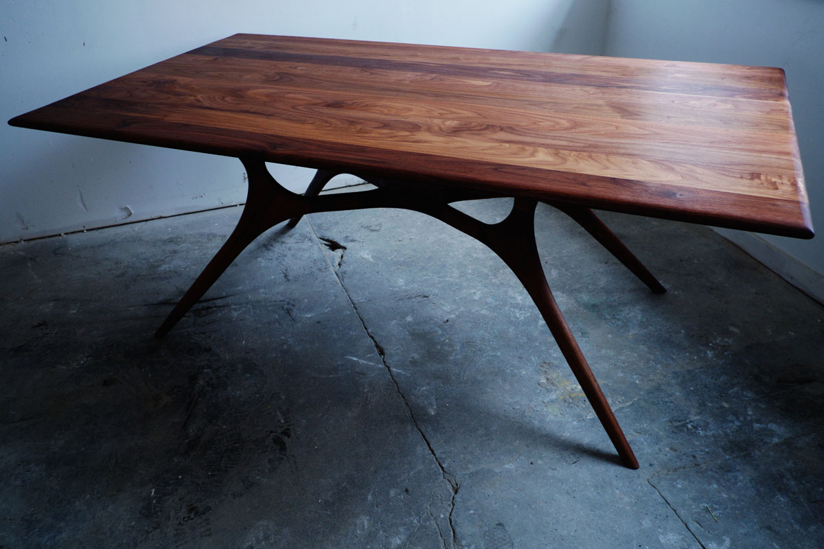 The walnut dining table by Weather Furniture