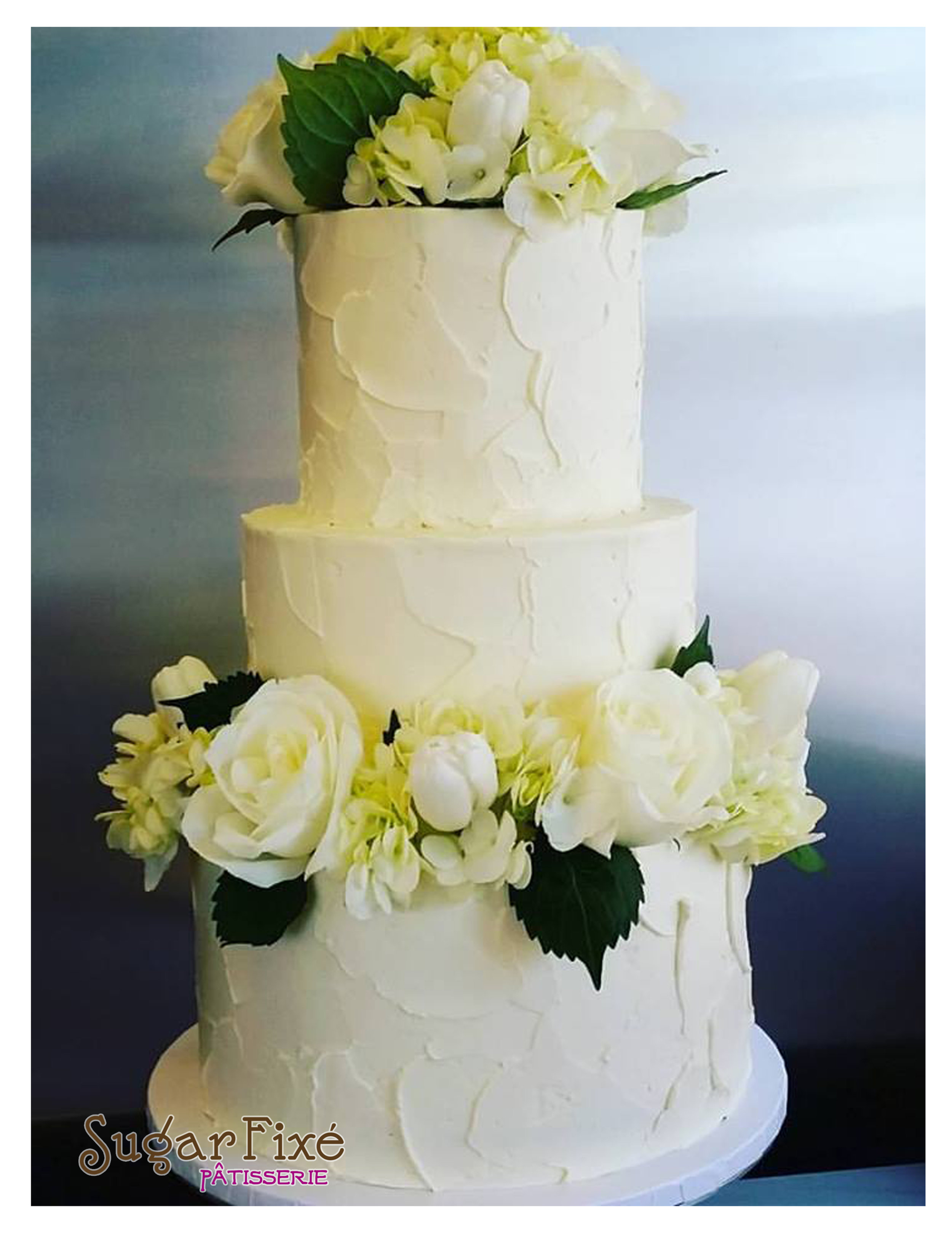 3 tier rustic fresh green and white florals.jpg