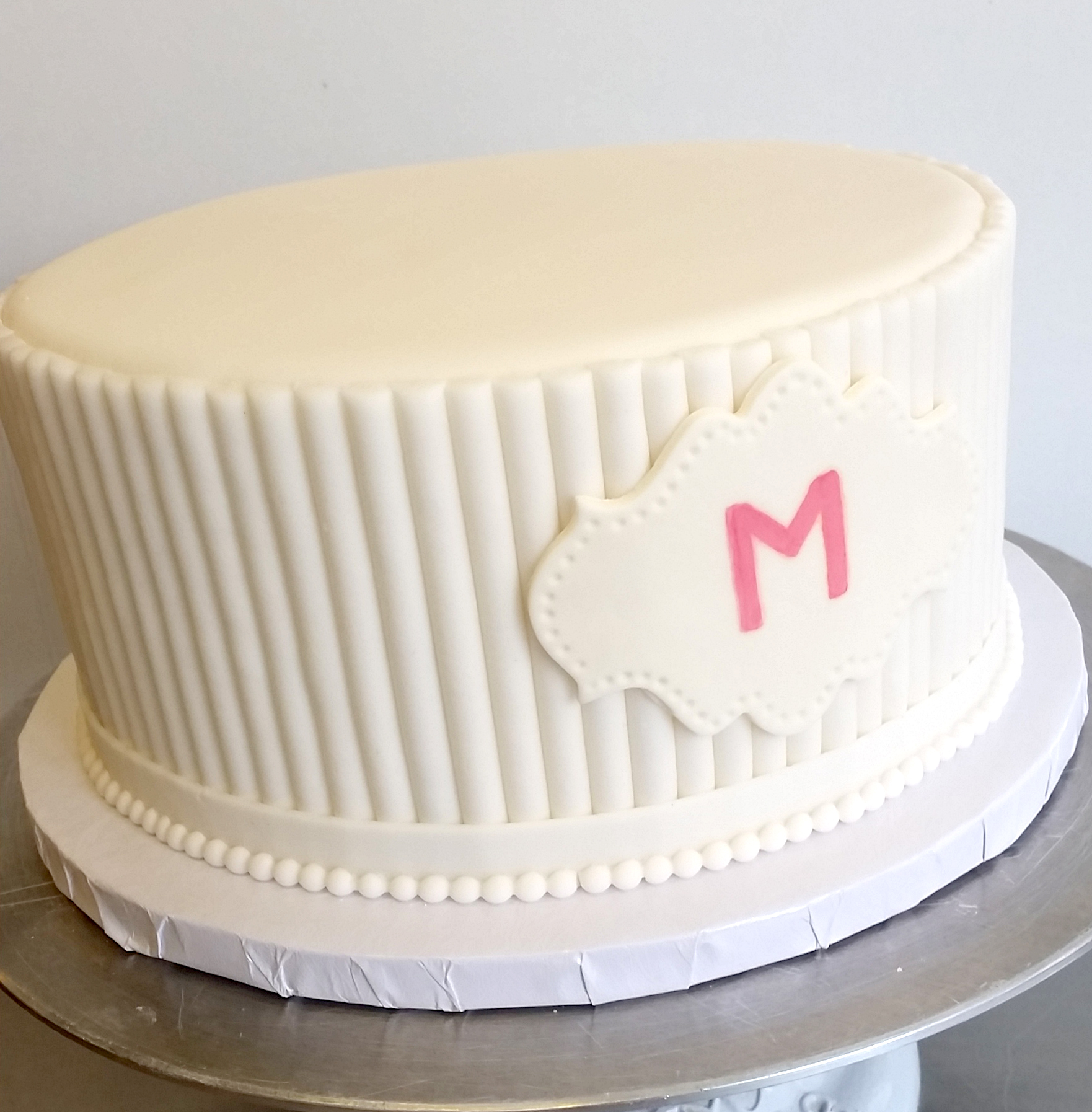 Fondant White texture cake with plaque.jpg