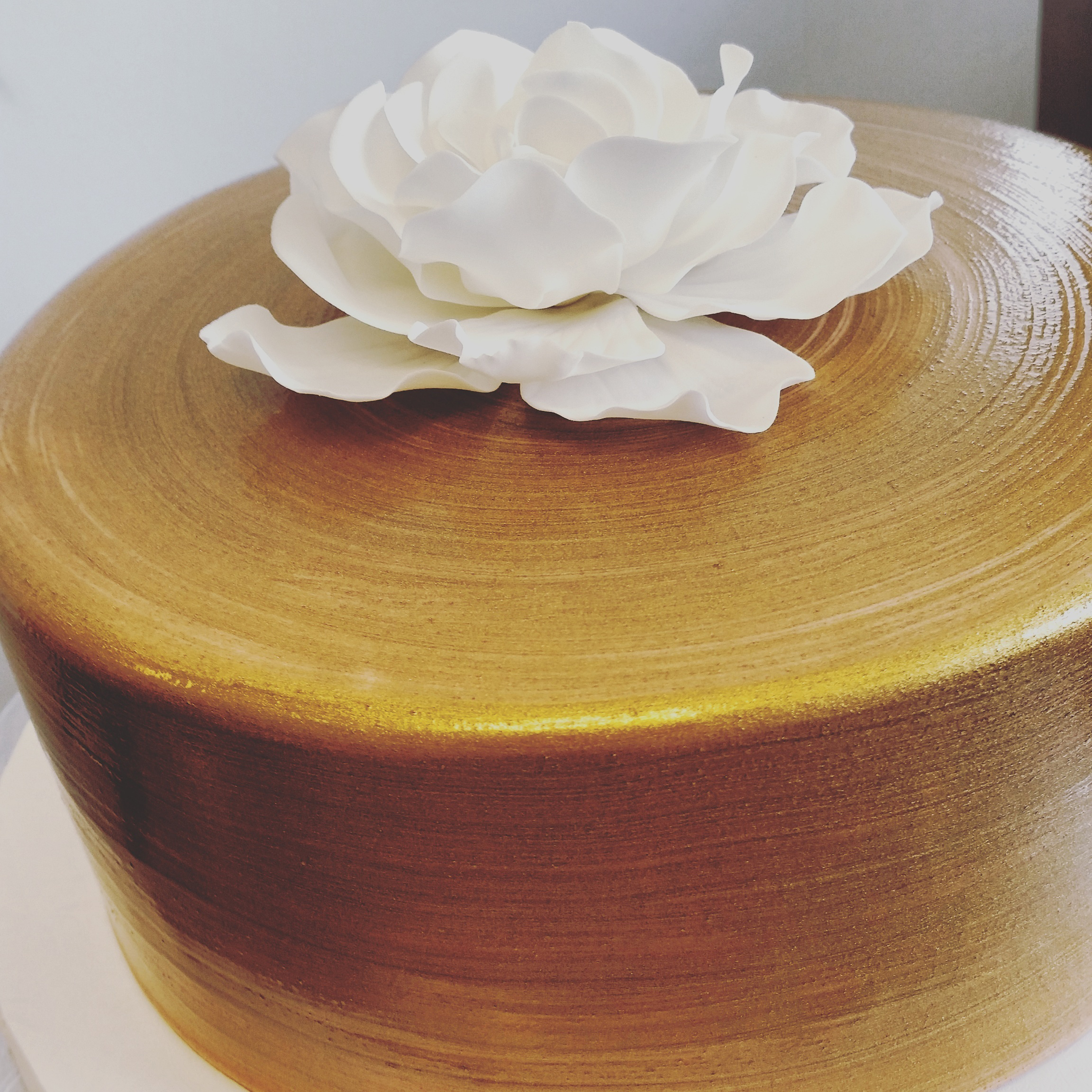 Gold painted with fondant flower.jpg