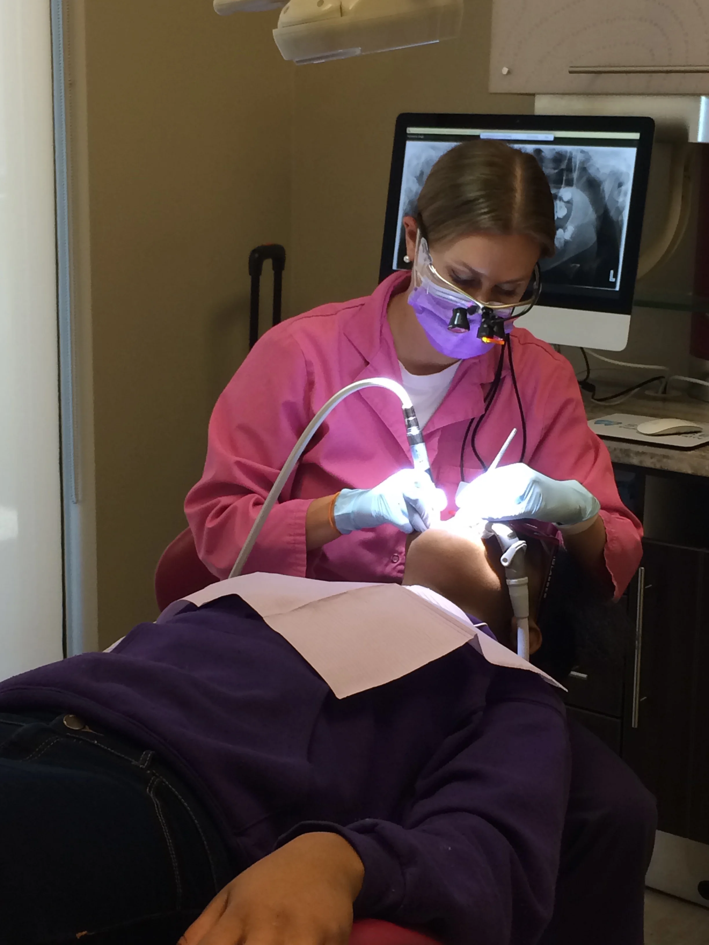 Dr. Crespi applying Sealants