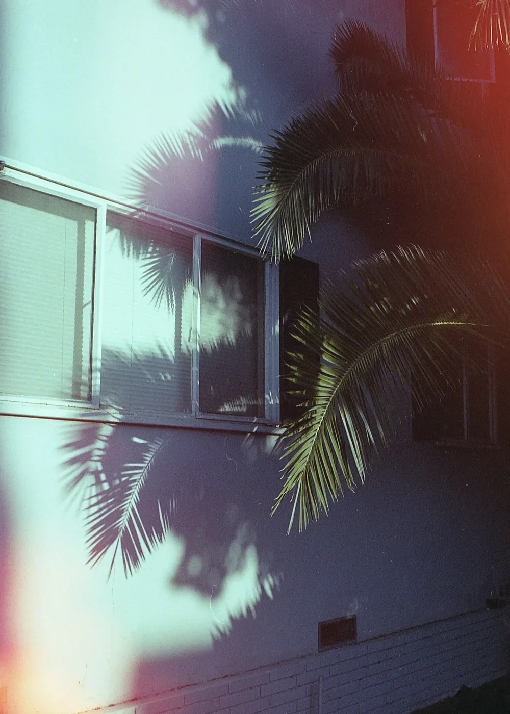 Psych Blues #3, pre-exposed 35mm film image of an apartment window