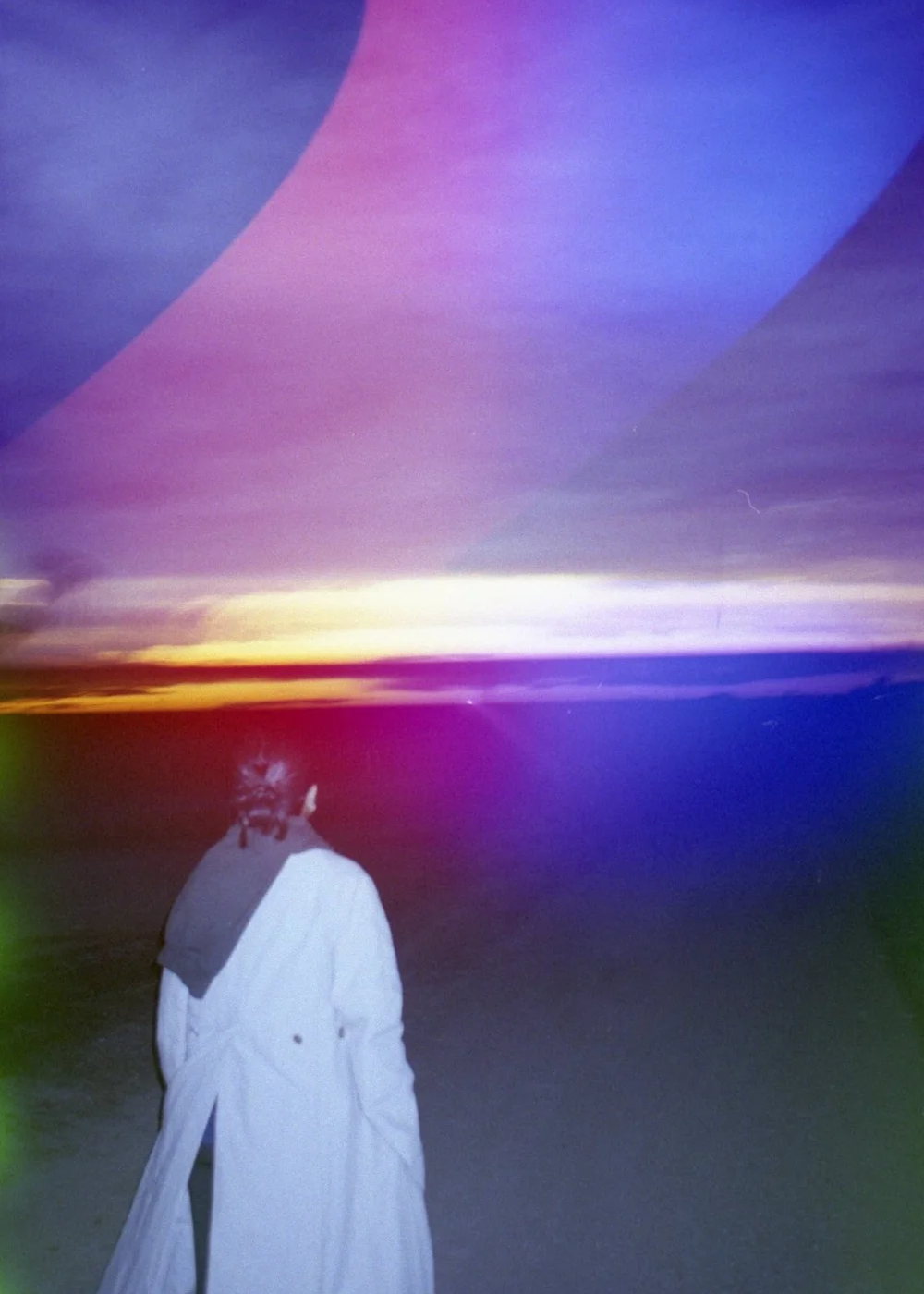 Psych Blues #7, pre-exposed analog film image of a girl against the sky