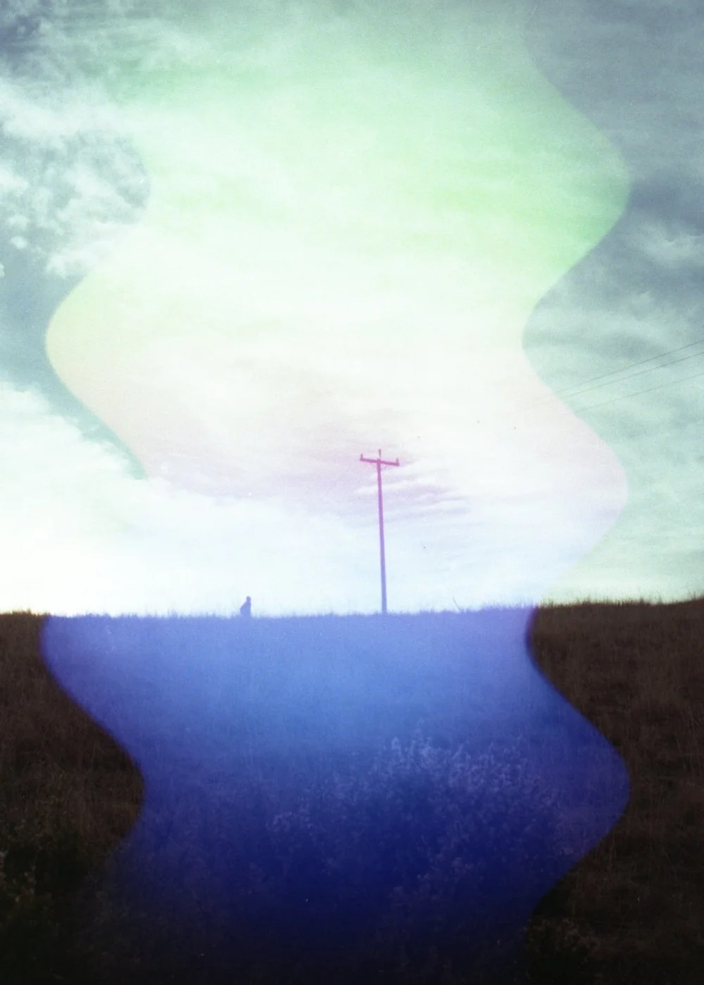 Psych Blues #7, pre-exposed 35mm film image of they sky and an electrical post