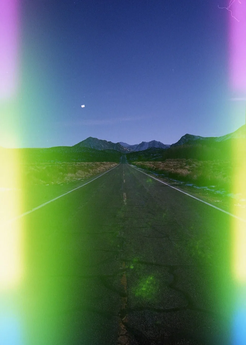 Empty road shot on Psych Blues 5, an analog experimental film stock