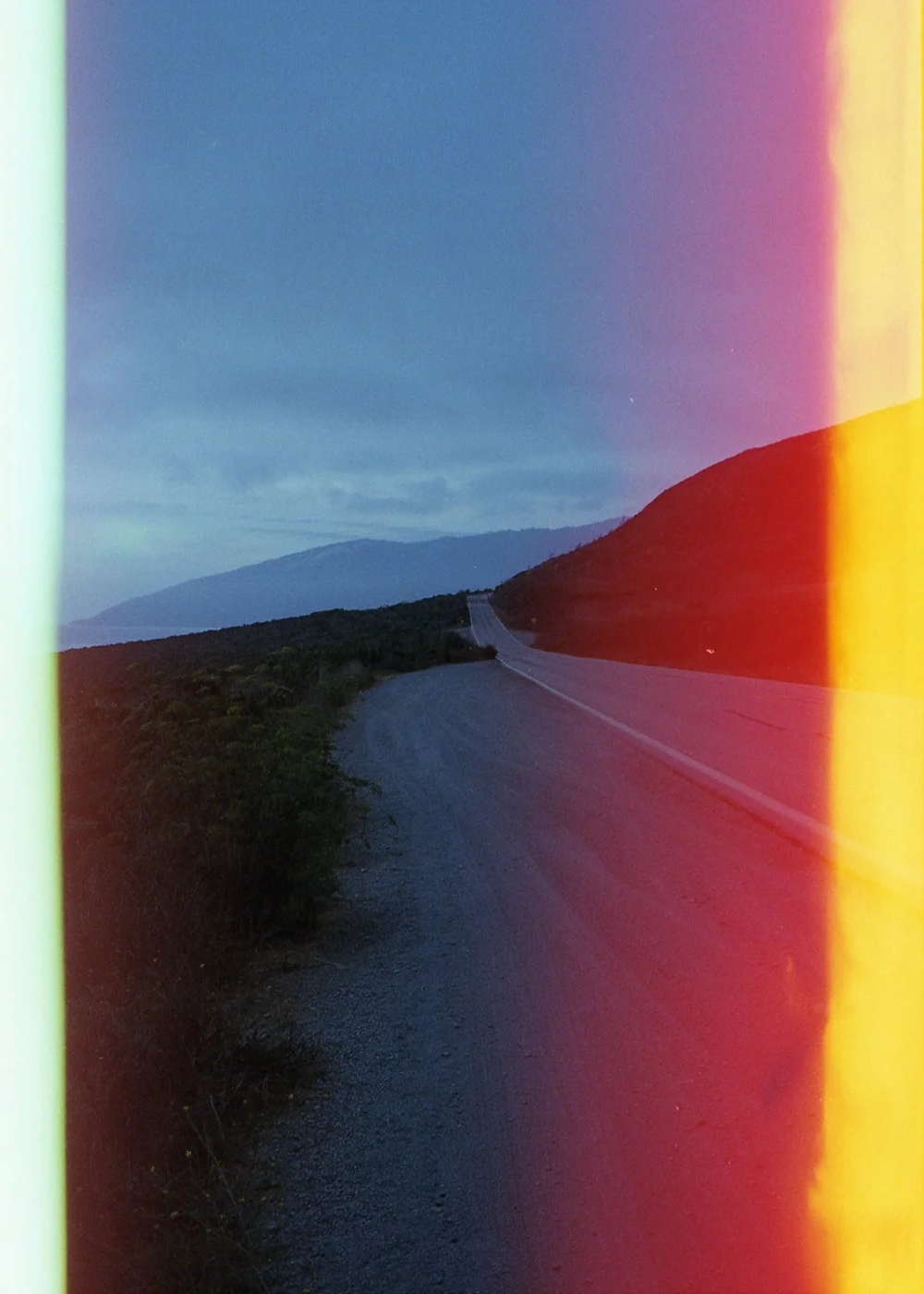 Psych Blues #2, pre-exposed 35mm film image of an empty road