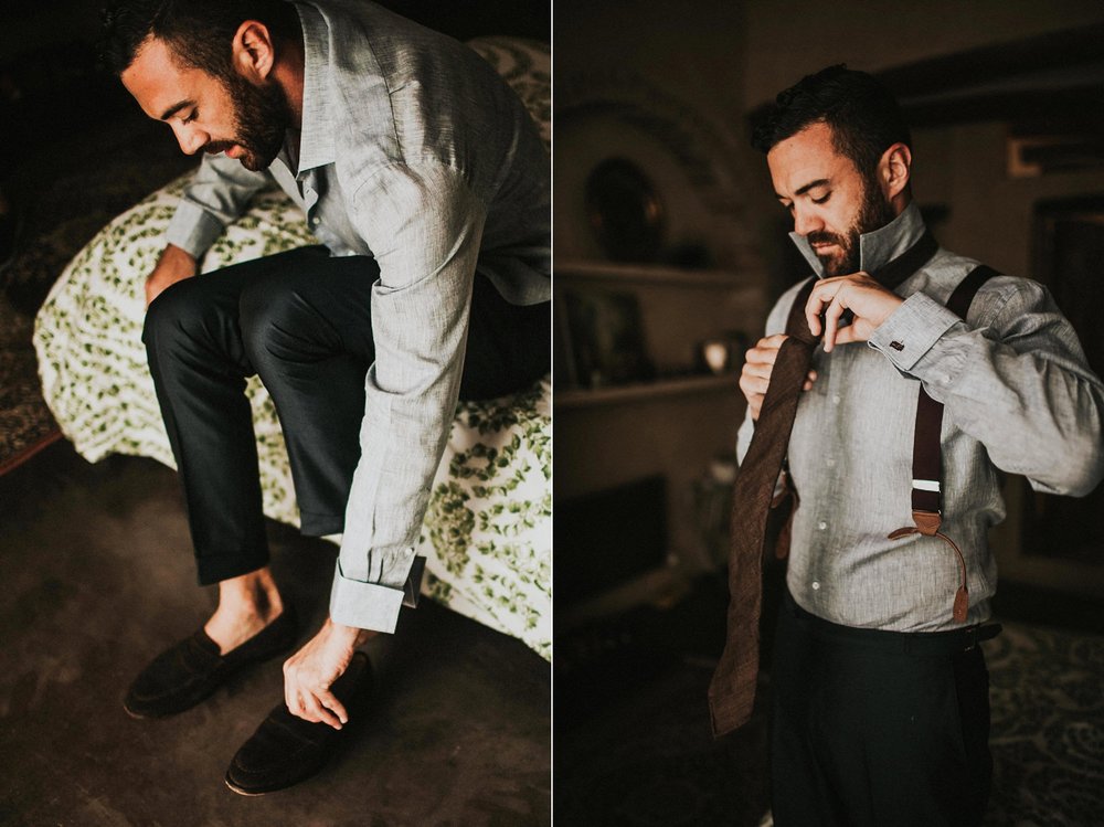  groom putting wedding shoes on 