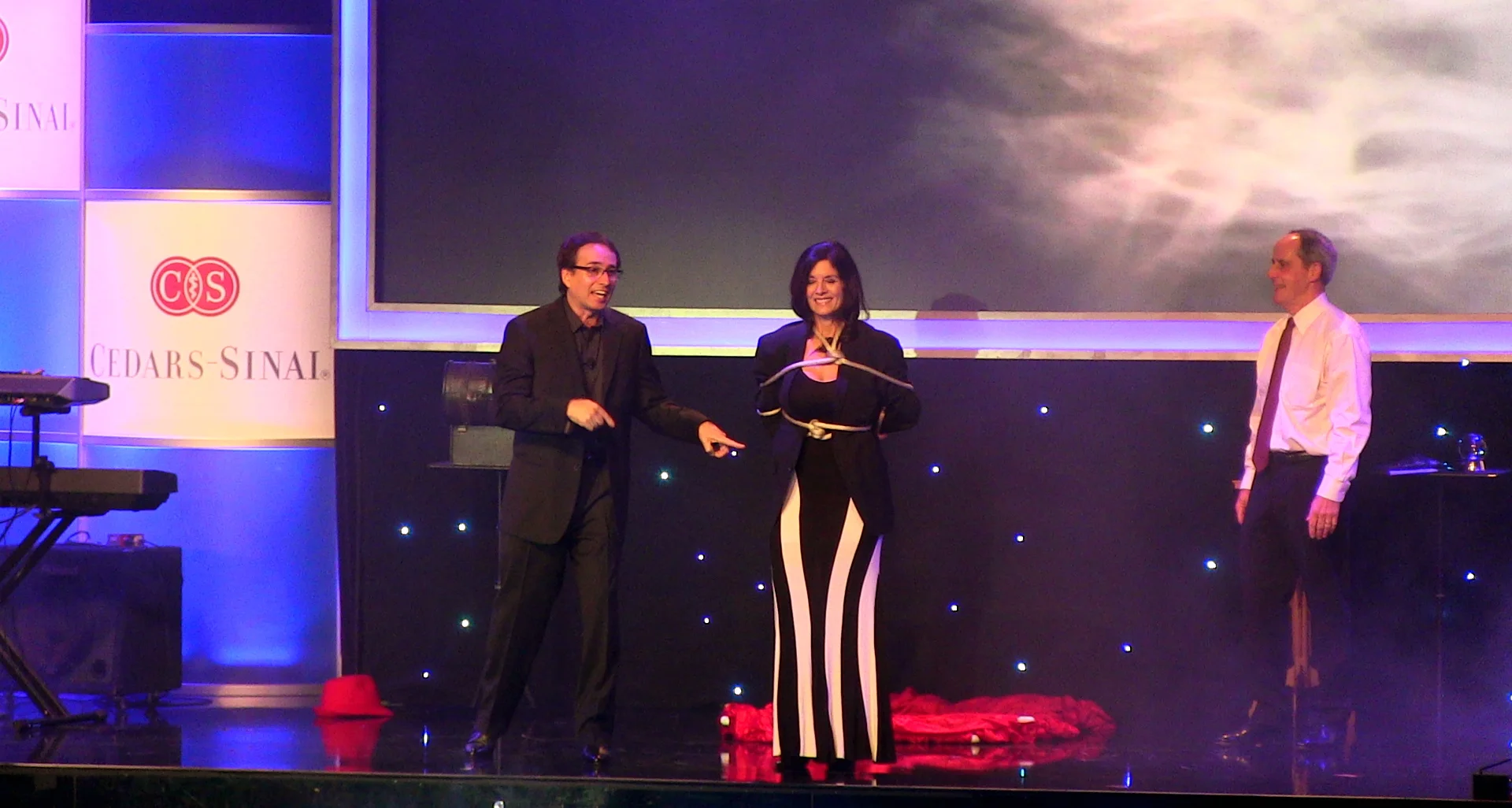 Corporate magicians, Lou Serrano and Dee Dee, performing in front of 500 people at a Corporate event N BEVERLY HILLS, CA&nbsp;for Cedars-sinai Medical Center.