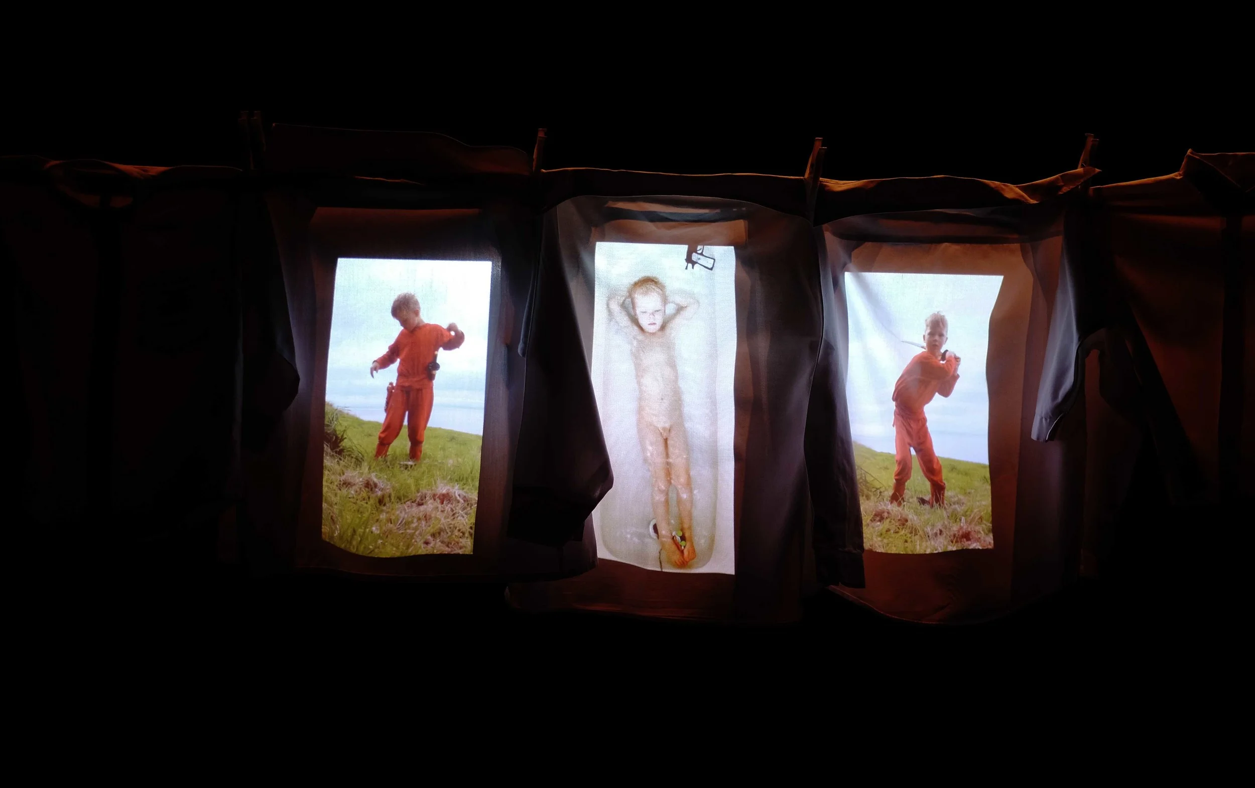 Big Blue Boy in Cable Factory May 2015. Videos, projected on children shirts, by Nora Rinne. Photo Antti Ahonen.