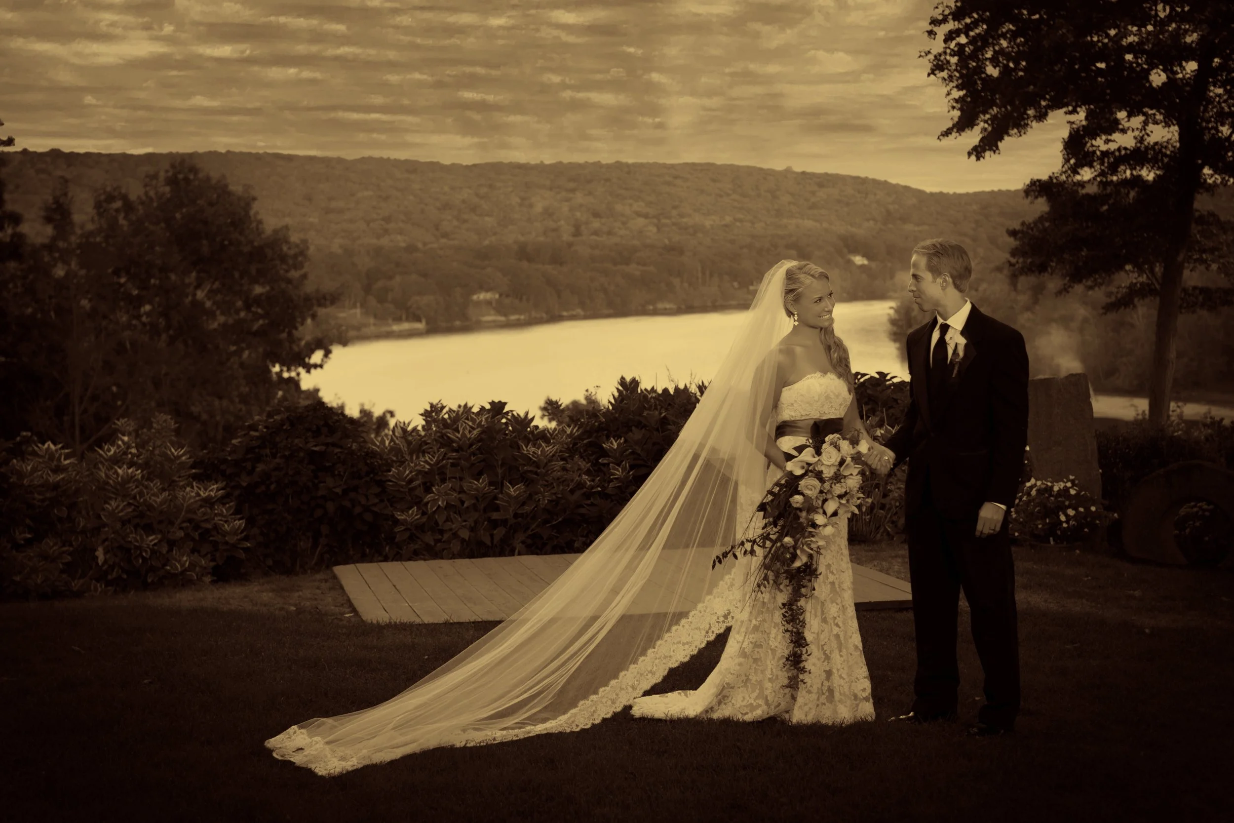 Bride and groom sharing a quiet moment overlooking the Connecticut River at Saint Clements Castle