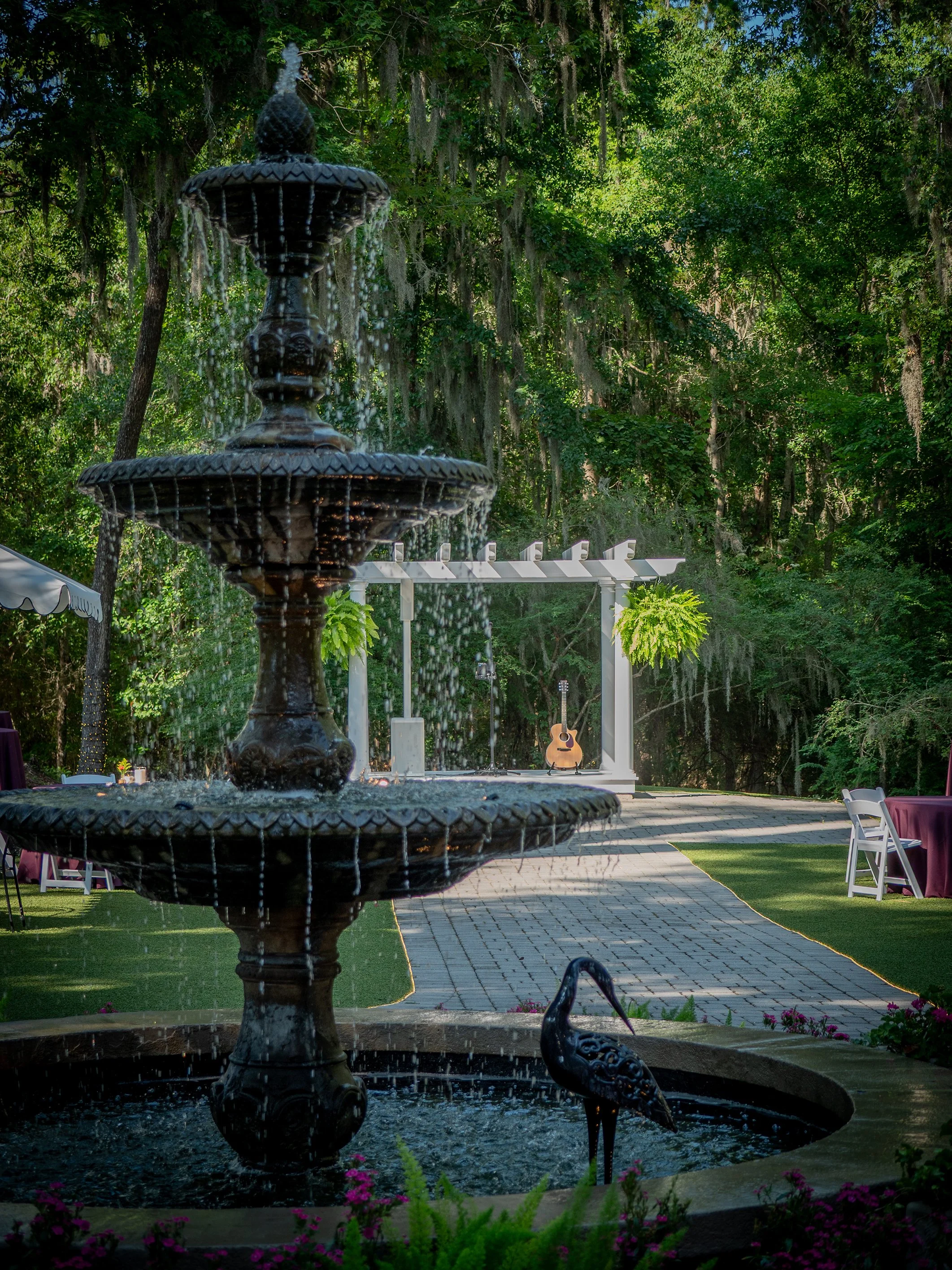 Garden fountain and live music performance area at The Mackey House event venue in Savannah Georgia.
