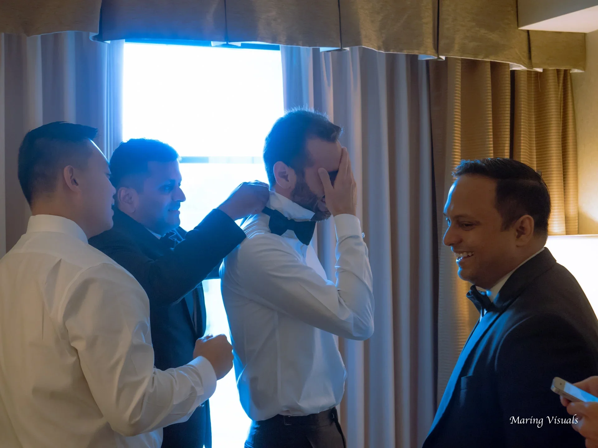Candid moments of the groom getting ready for a Saint Clements Castle Wedding