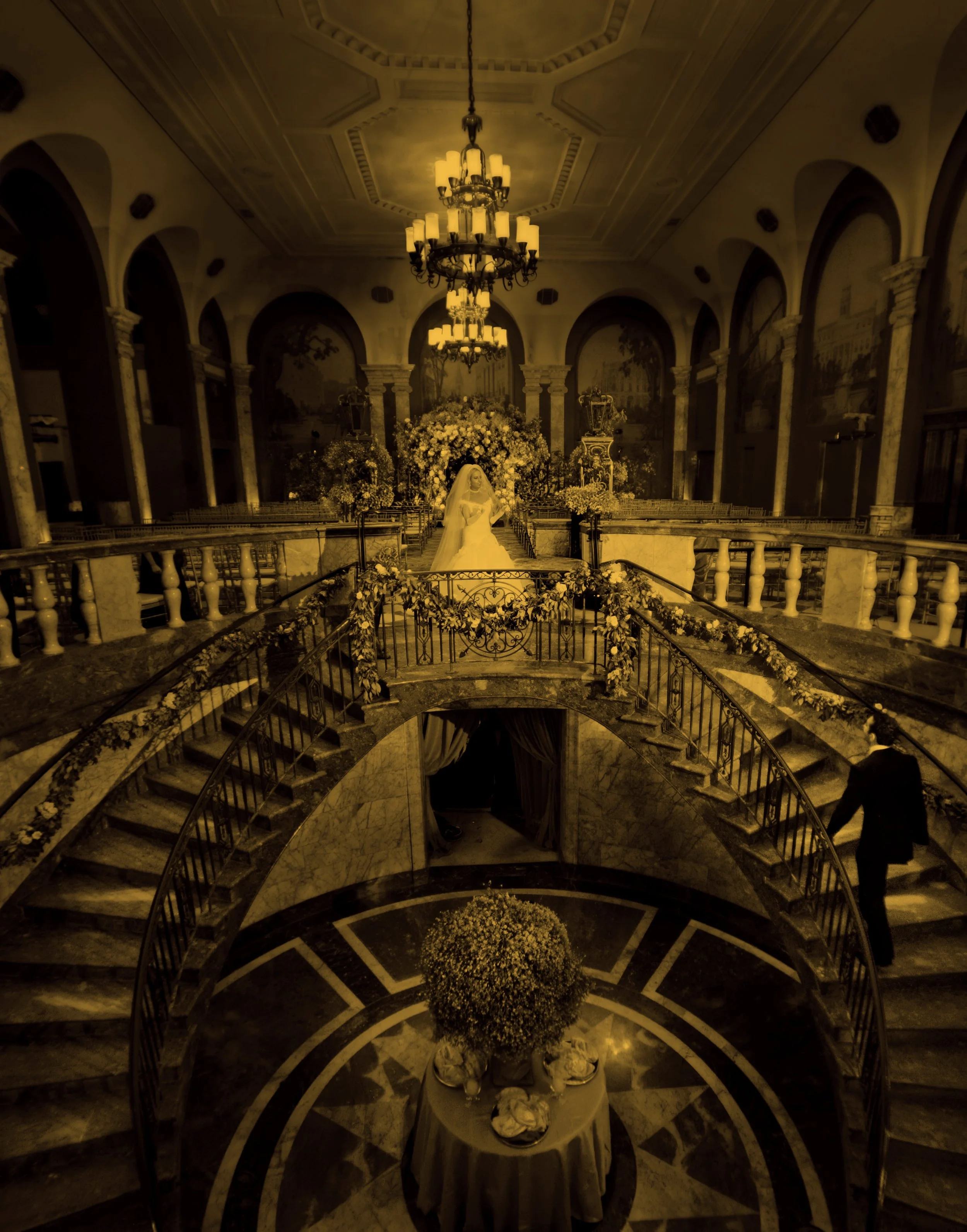 Bride and groom share first look on the grand staircase at 48 Wall Street luxury wedding ceremony NYC