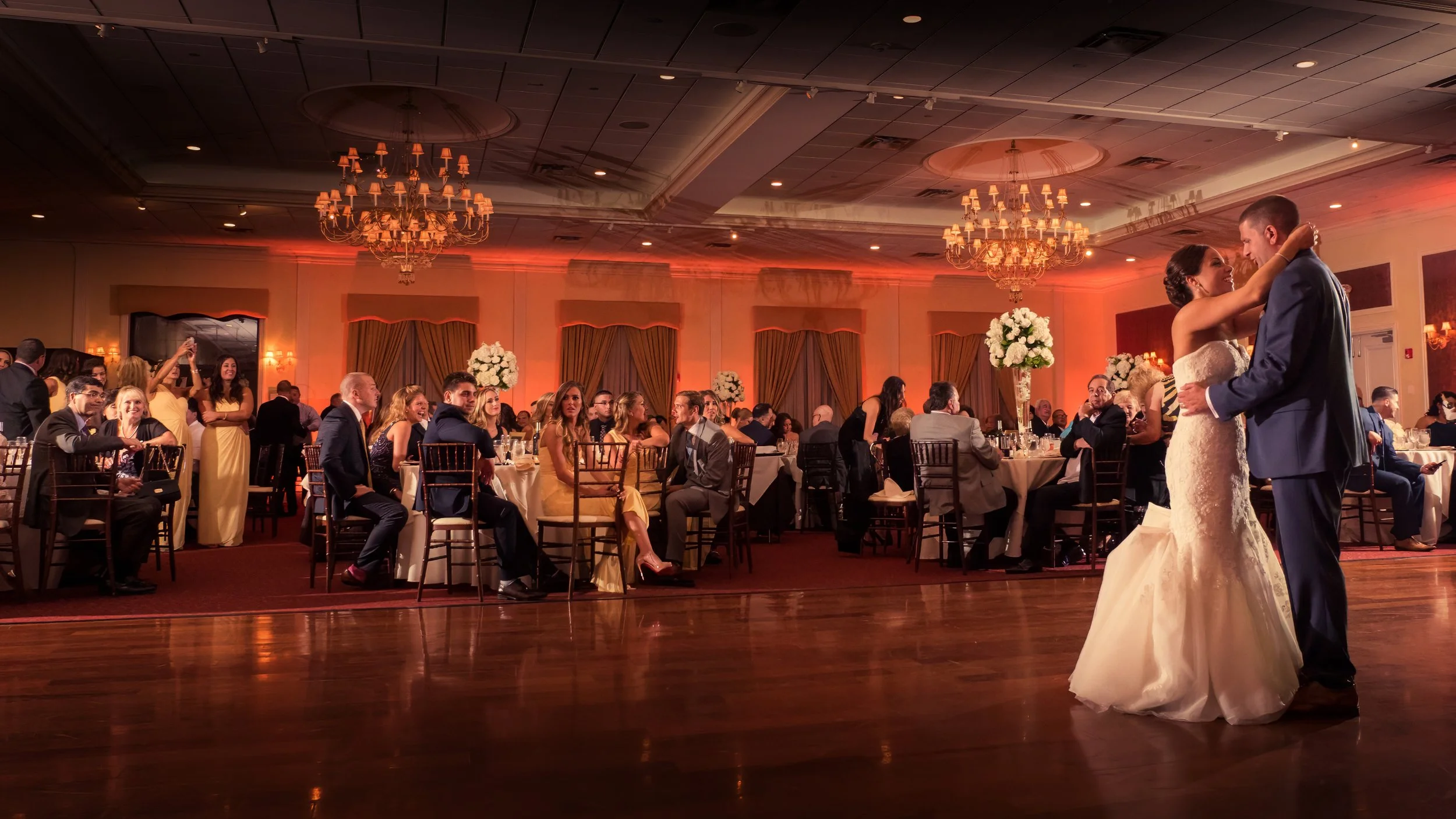 Wide-angle view of the bride and groom dancing at The Grandview.