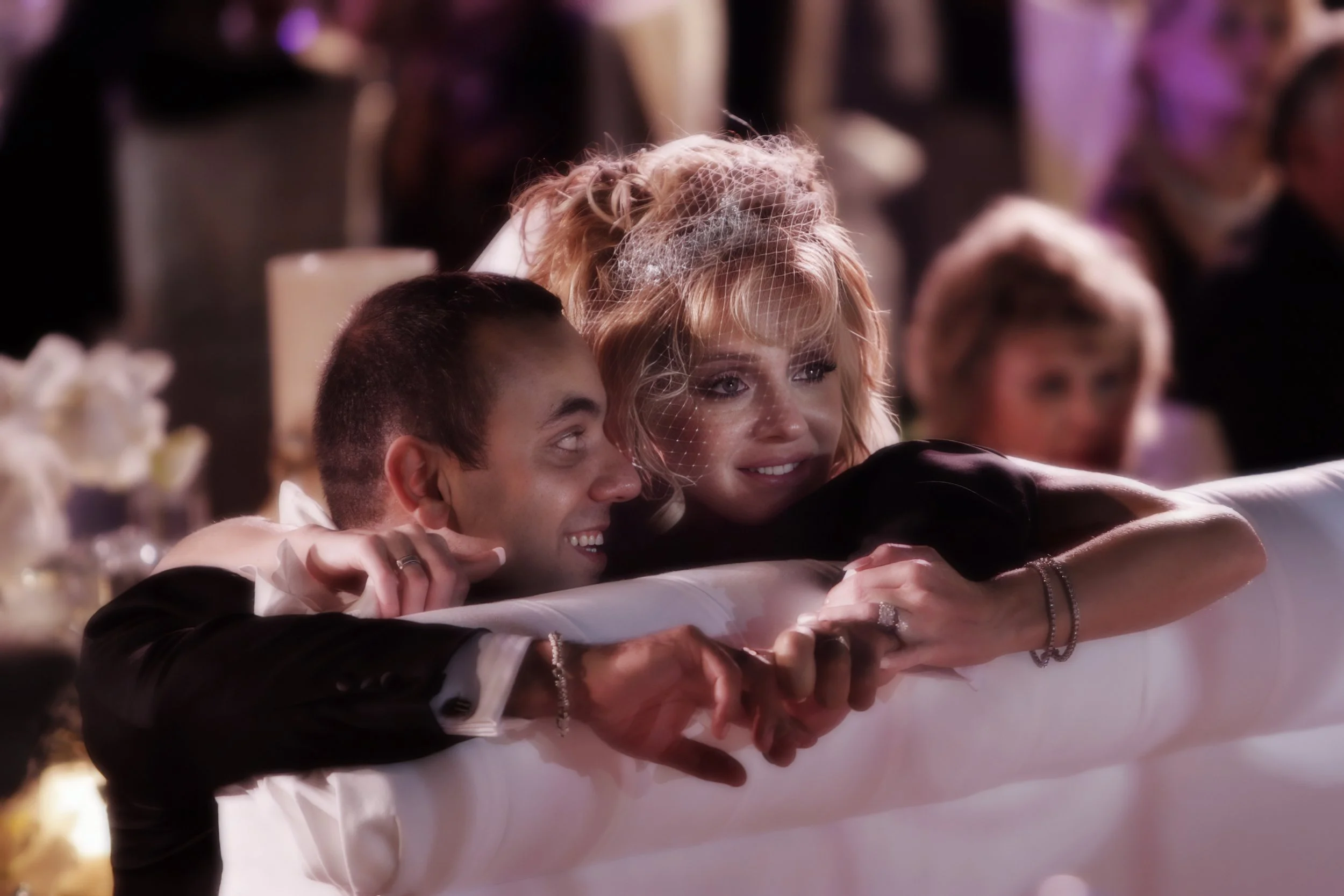 Candid luxury wedding portrait of bride and groom reacting emotionally during their Florida celebration