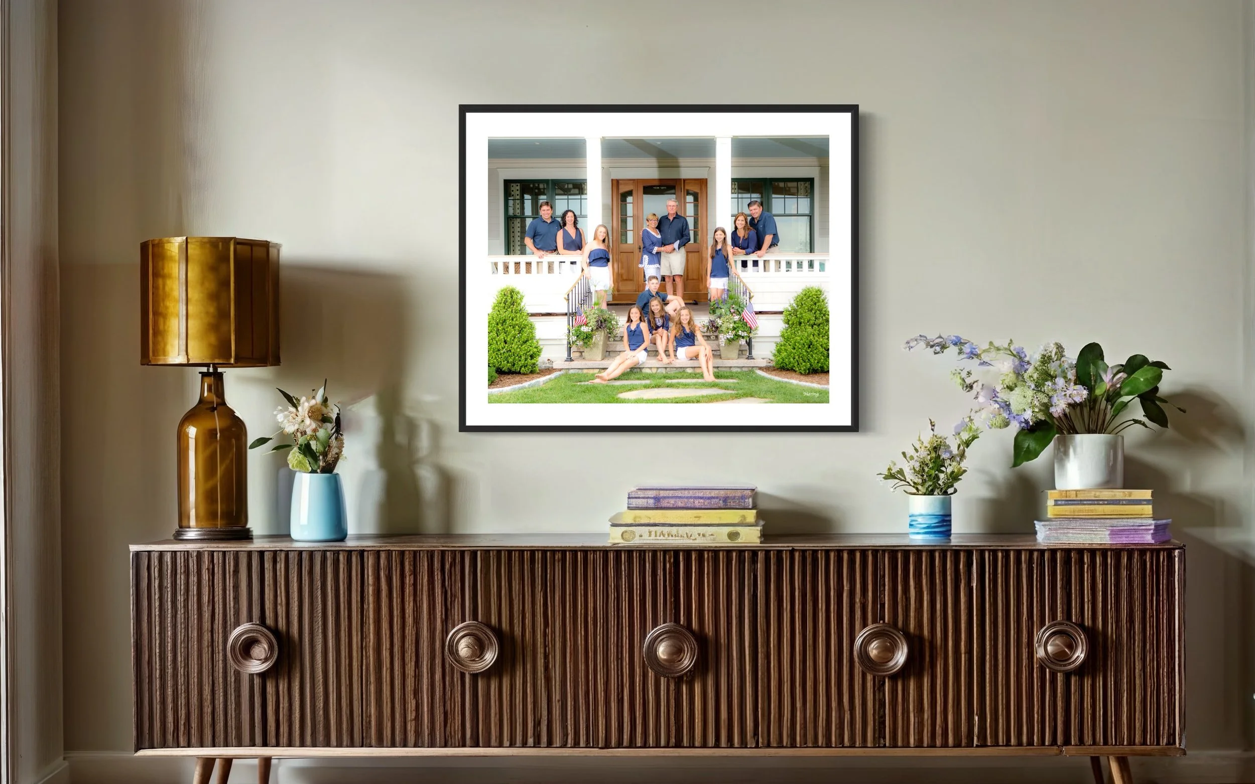 Guilford family portrait displayed in a framed gallery wall in a luxury home