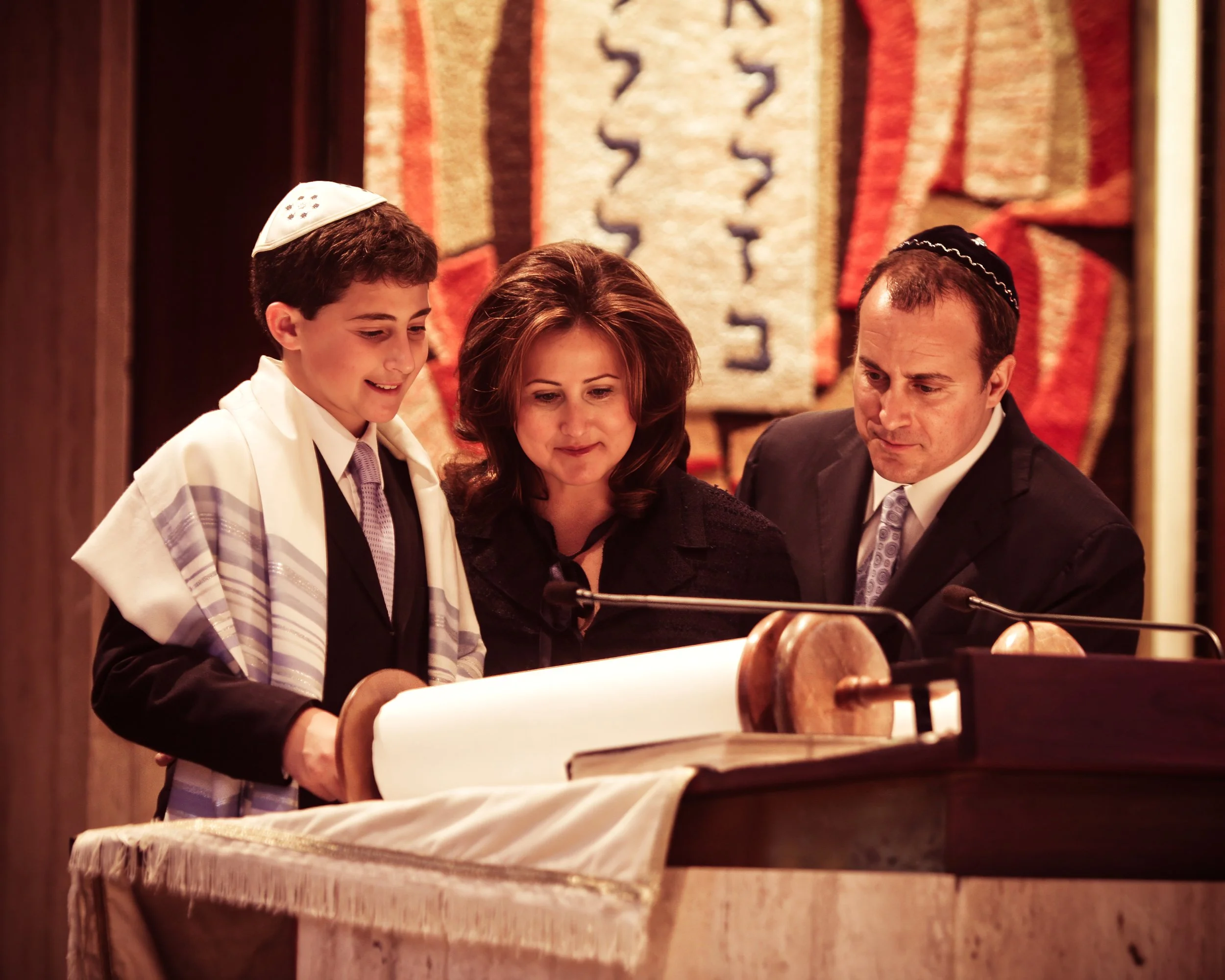 Parents and Son ready from the Torah