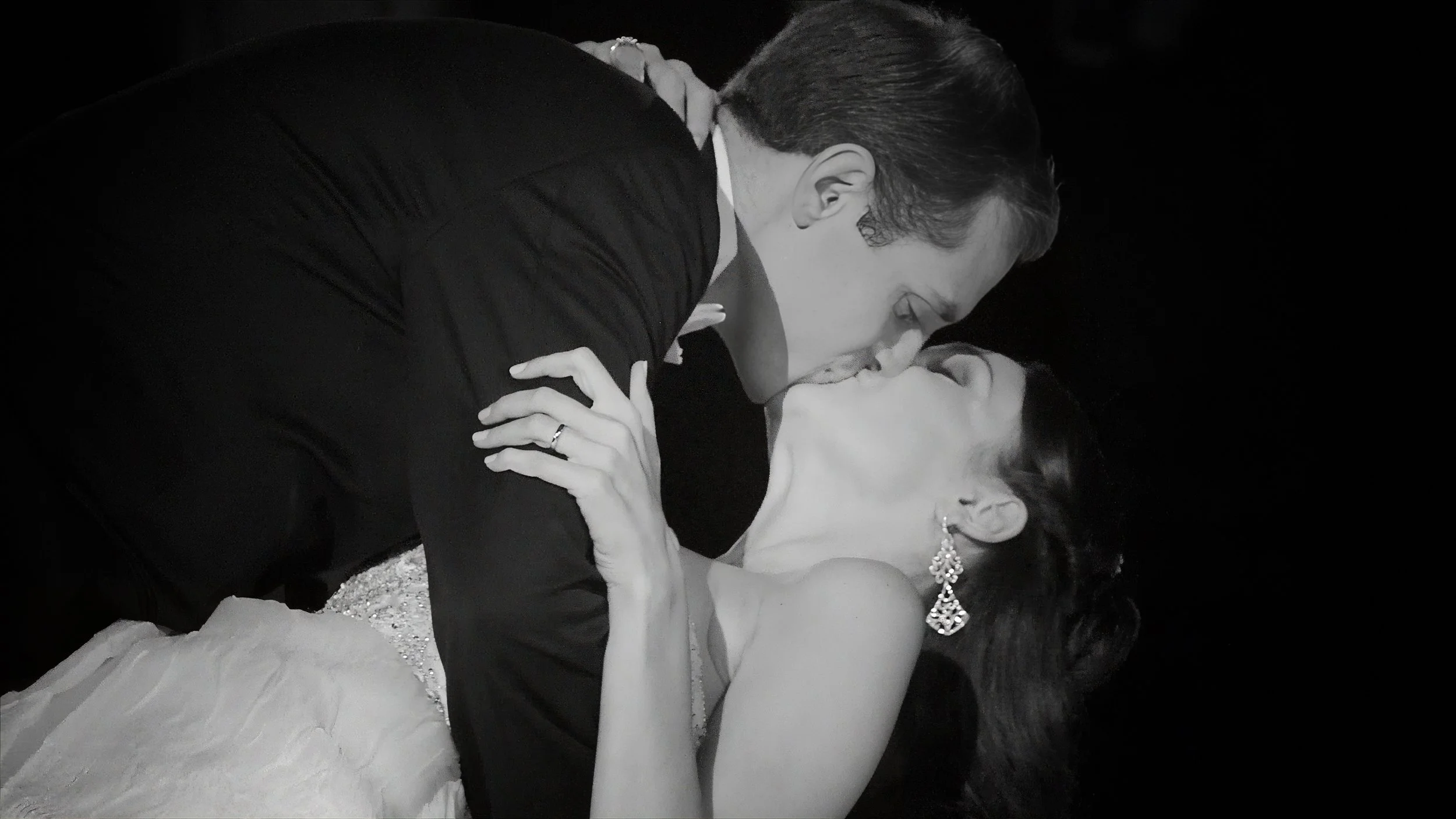 Groom Dips Bride During First Dance