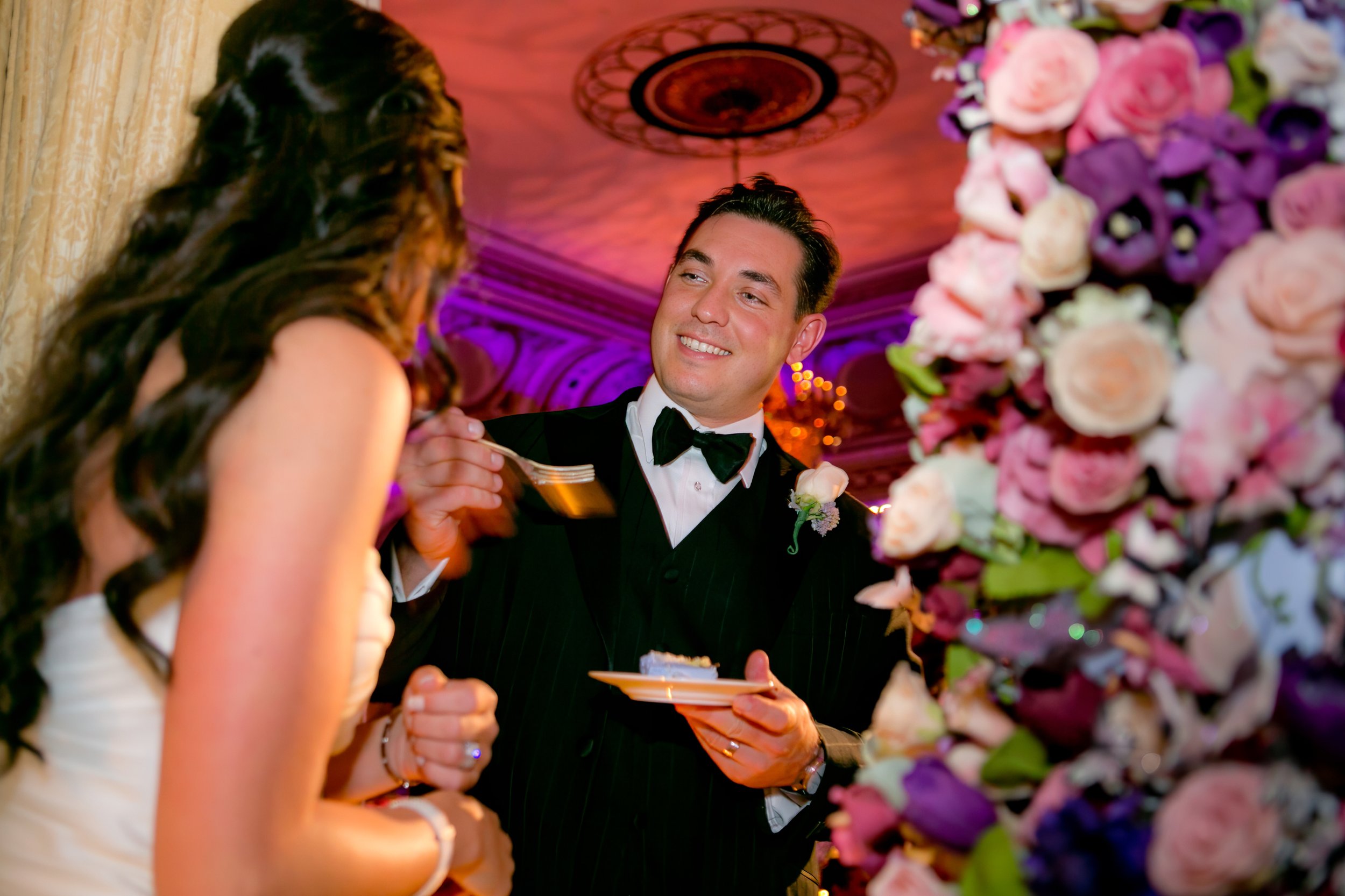 Groom Feeds Bride Wedding Cake