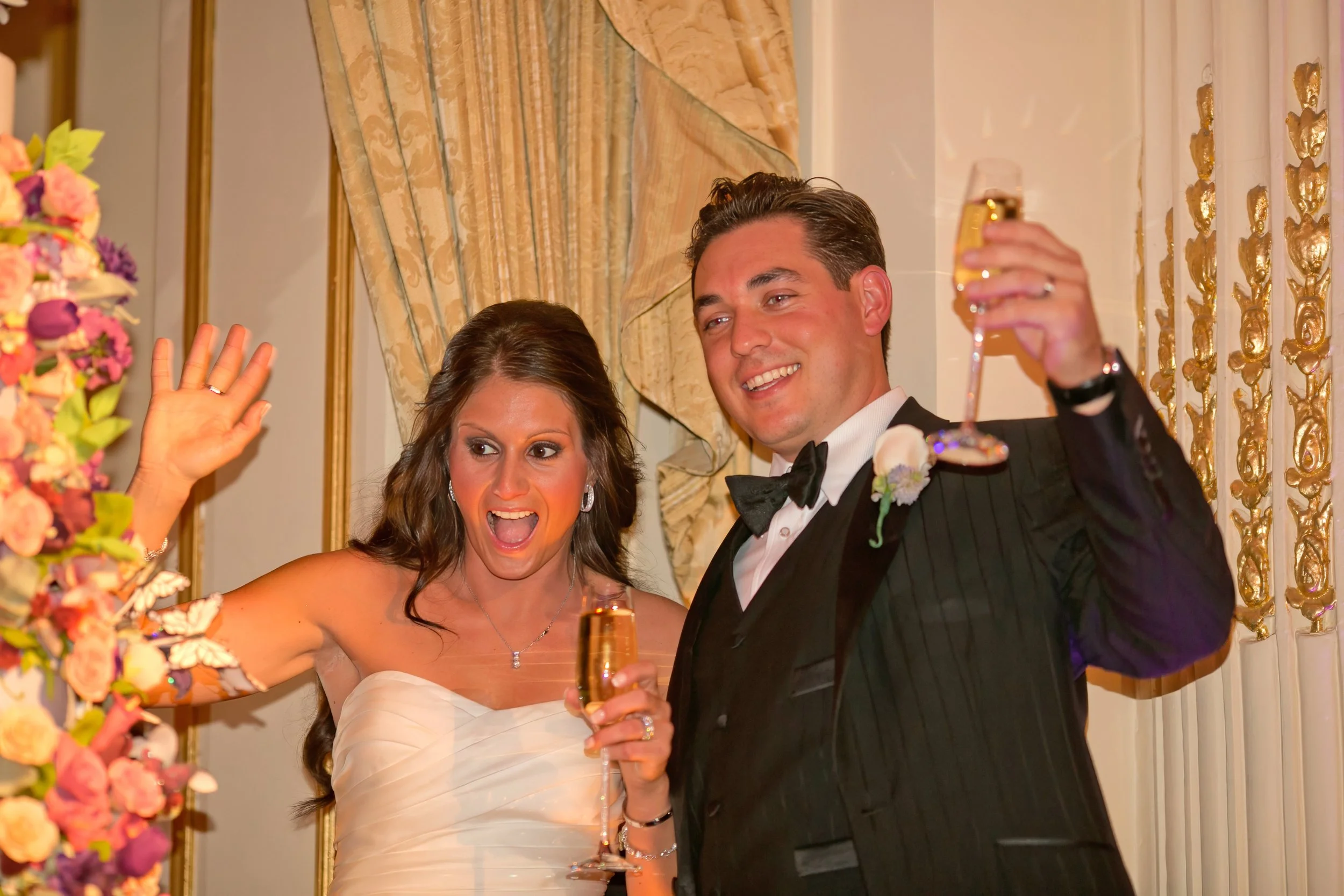 Bride and Groom Raise Glasses to Guests