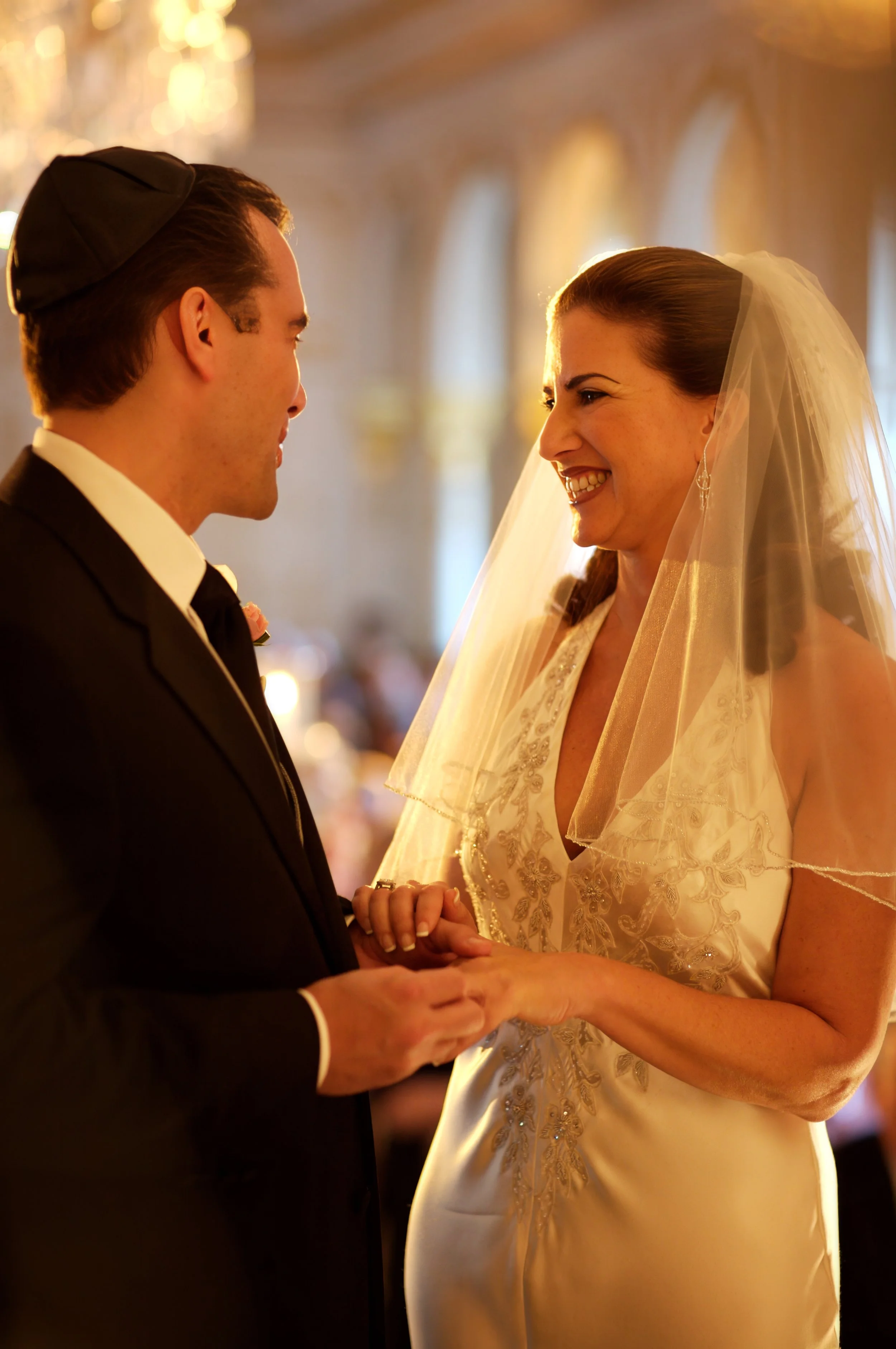 A bride and groom exchange rings 