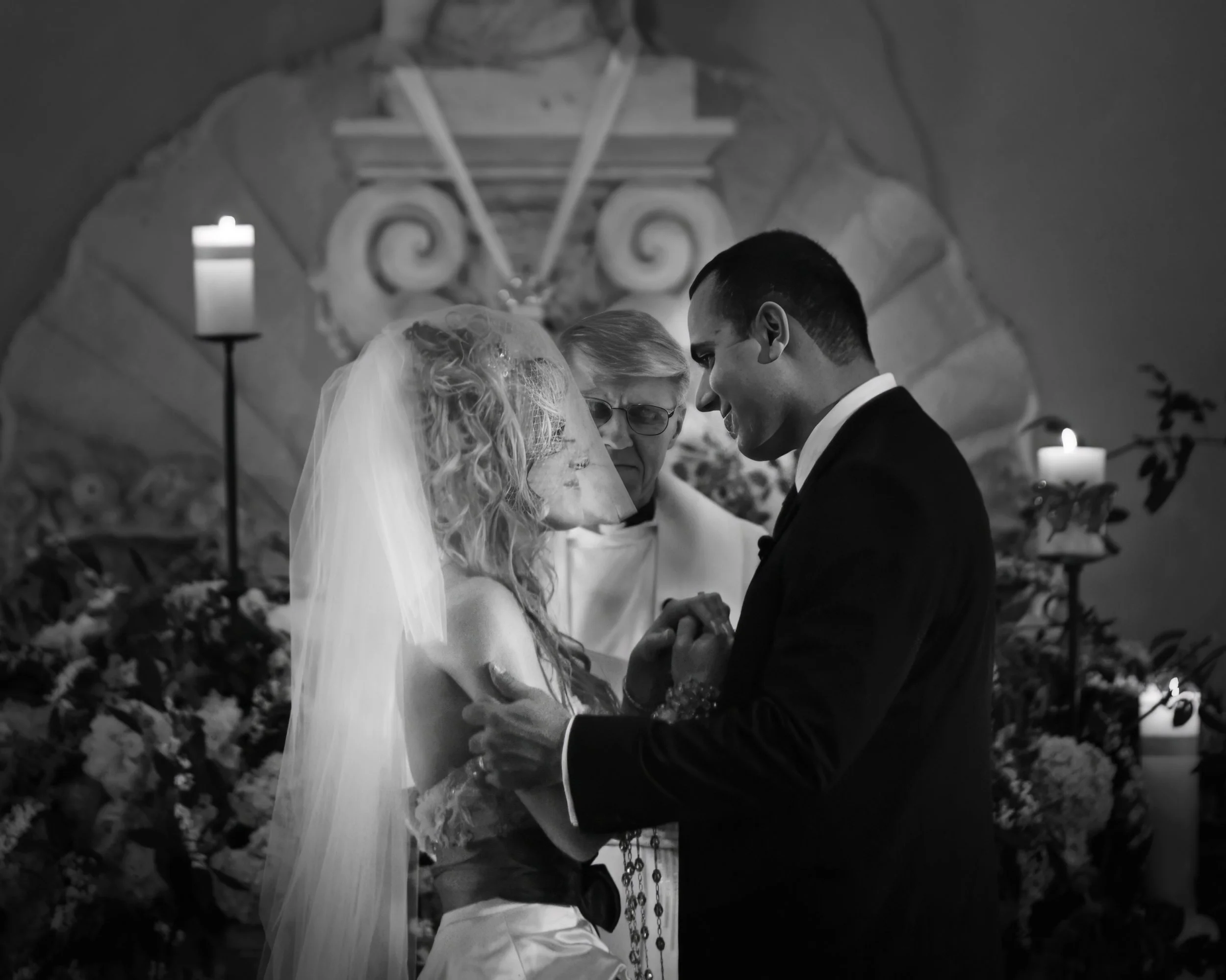 Bride and groom looking into each other's eyes during a wedding ceremony at the Ringling Museum in Sarasota