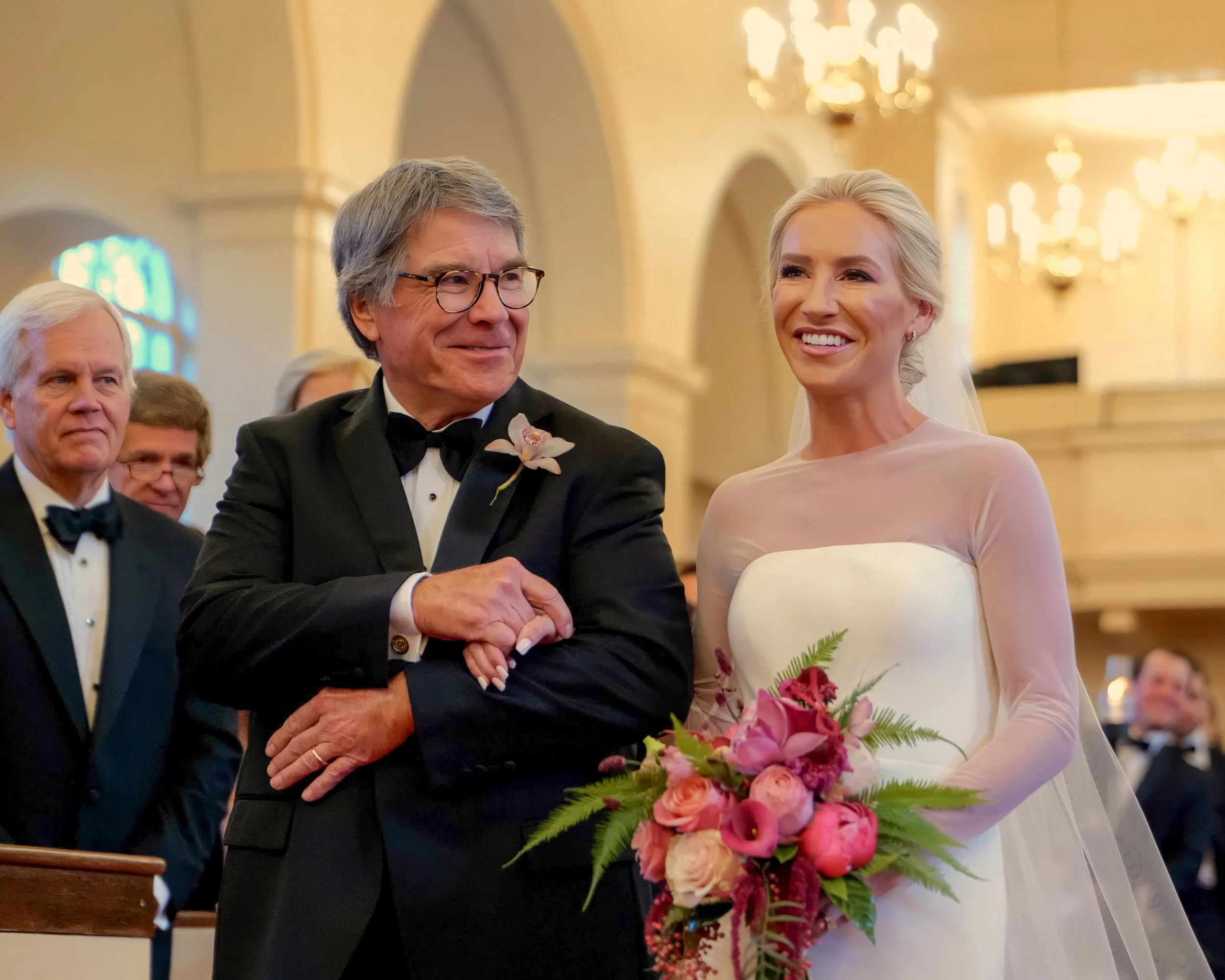 Father of the bride walks his daughter down the aisle in the Pinehurst Village Chapel.