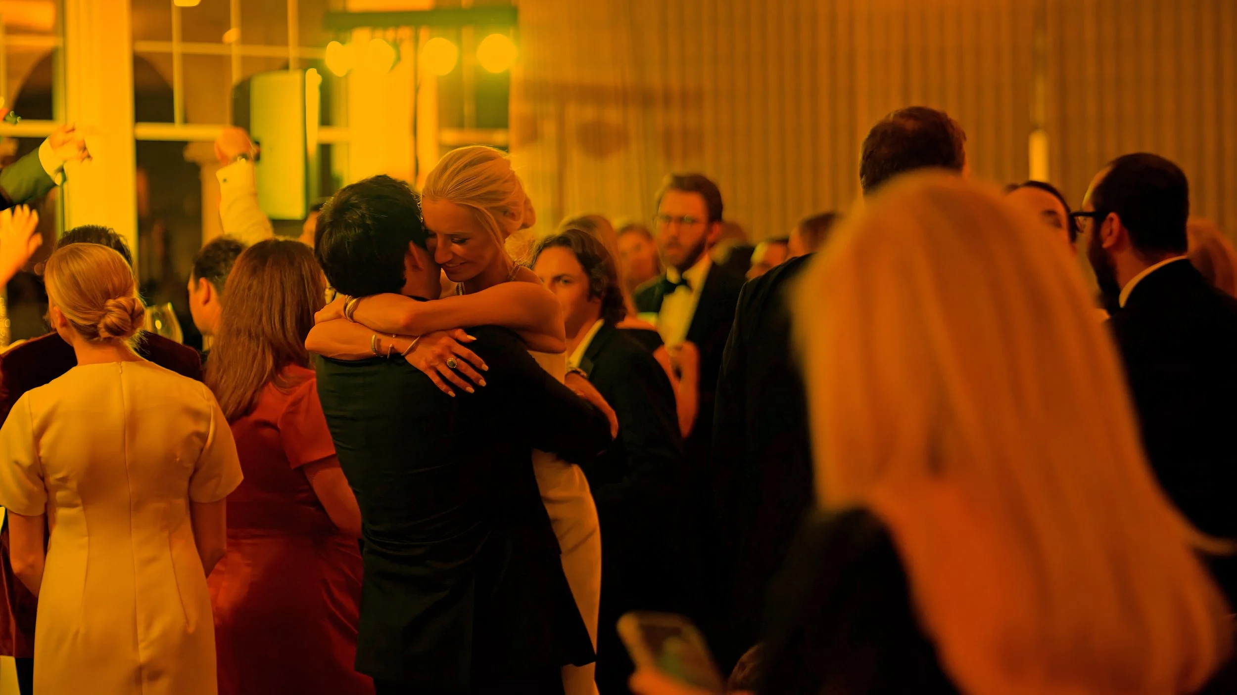 Groom Lifts Bride for a Kiss on the Dance Floor