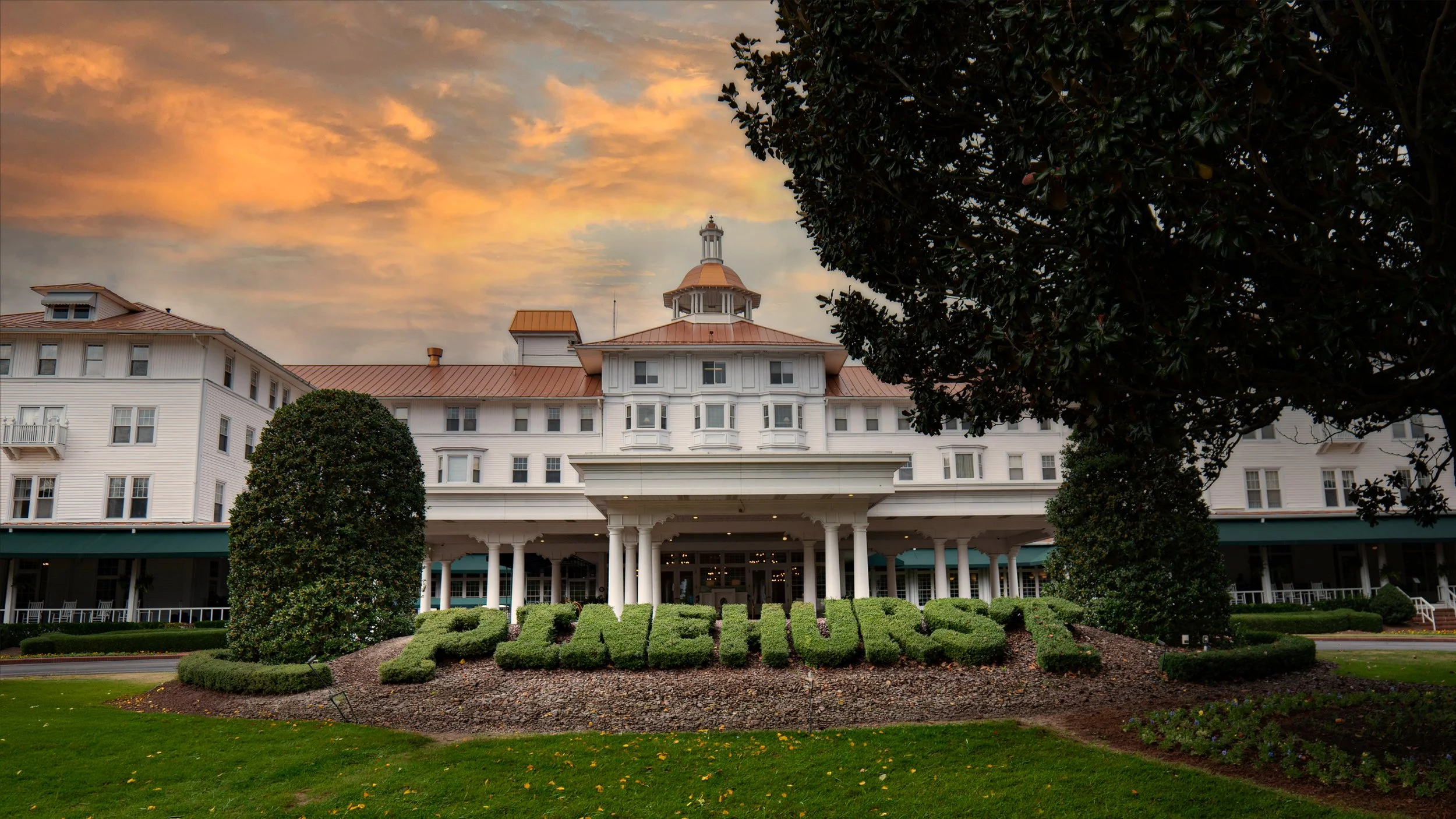 Sweeping exterior view of the Carolina Hotel at Pinehurst Resort.