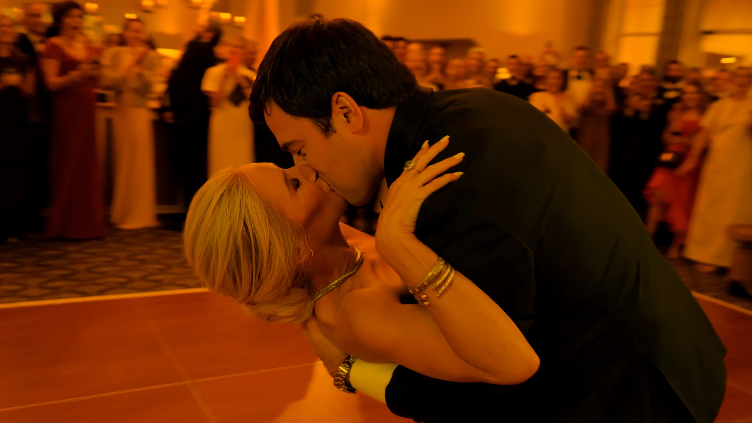 Groom dipping the bride for a kiss during their first dance at a Pinehurst Resort wedding reception.