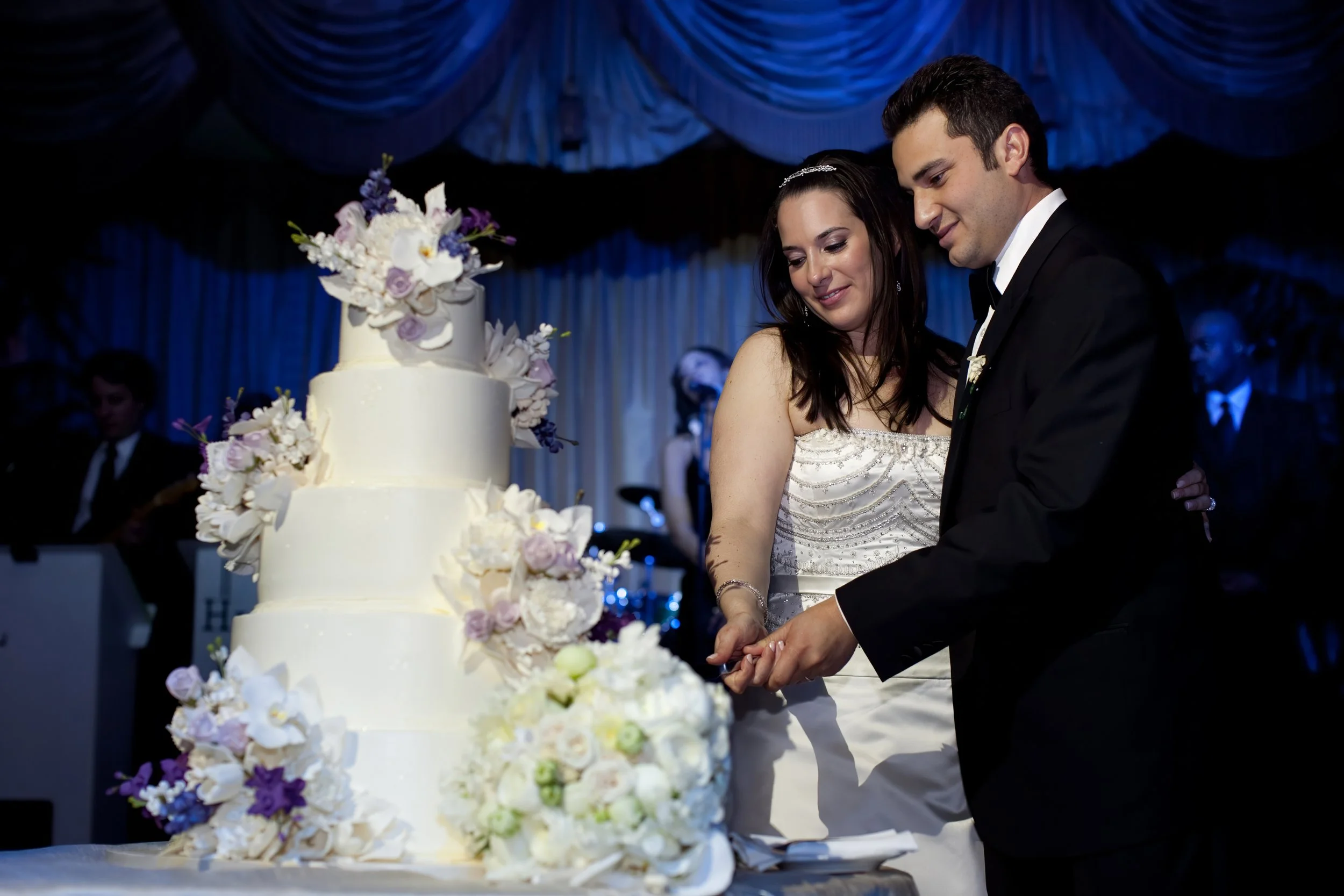 Bride and Groom Cut Wedding Cake in Grand Ballroom