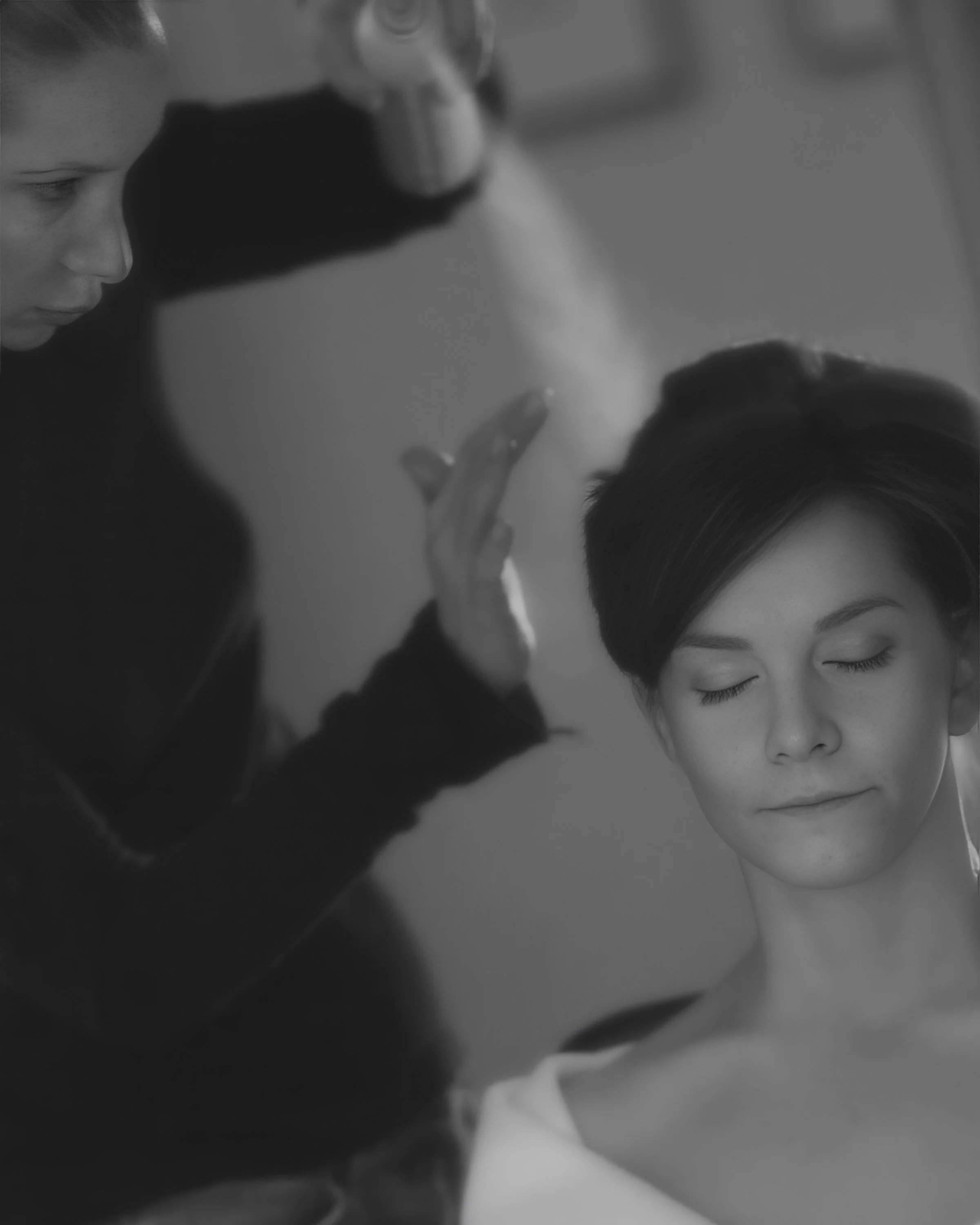 Groom kisses the bride’s hand during their first look in a luxury suite at The Pierre Hotel NYC.