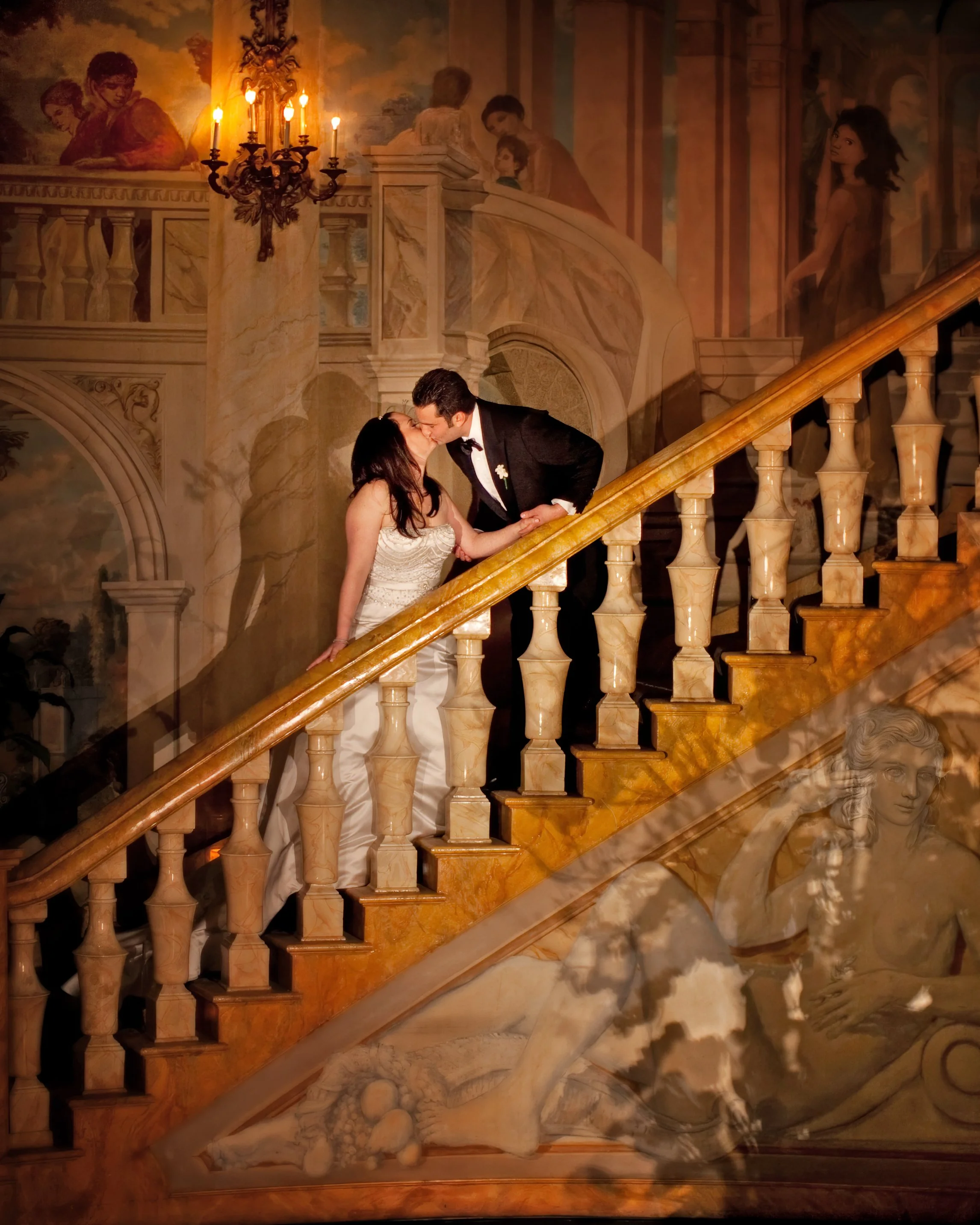 Bride and Groom Kiss on Rotunda Room Staircase