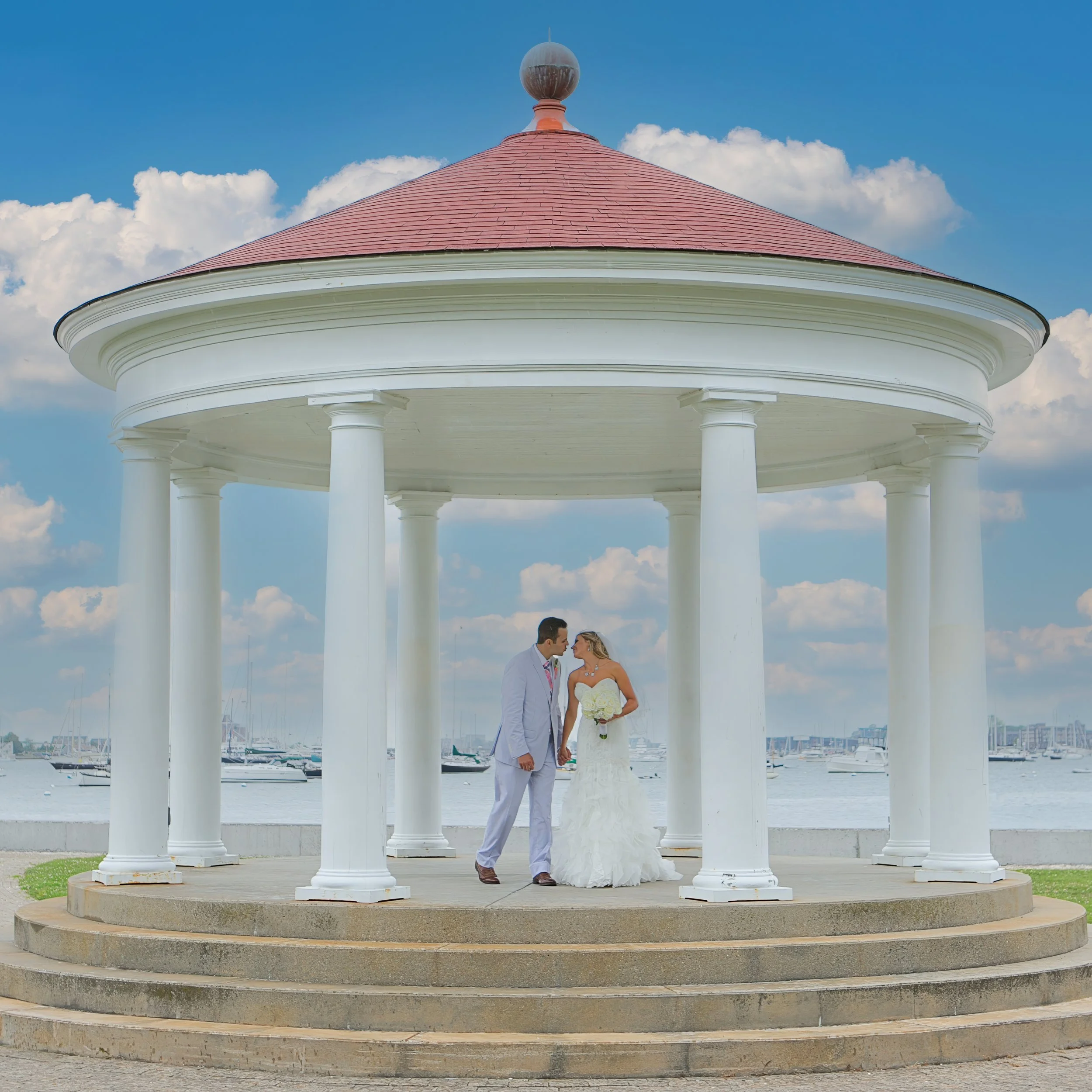 Bride and Groom Kiss Overlooking Newport Harbor