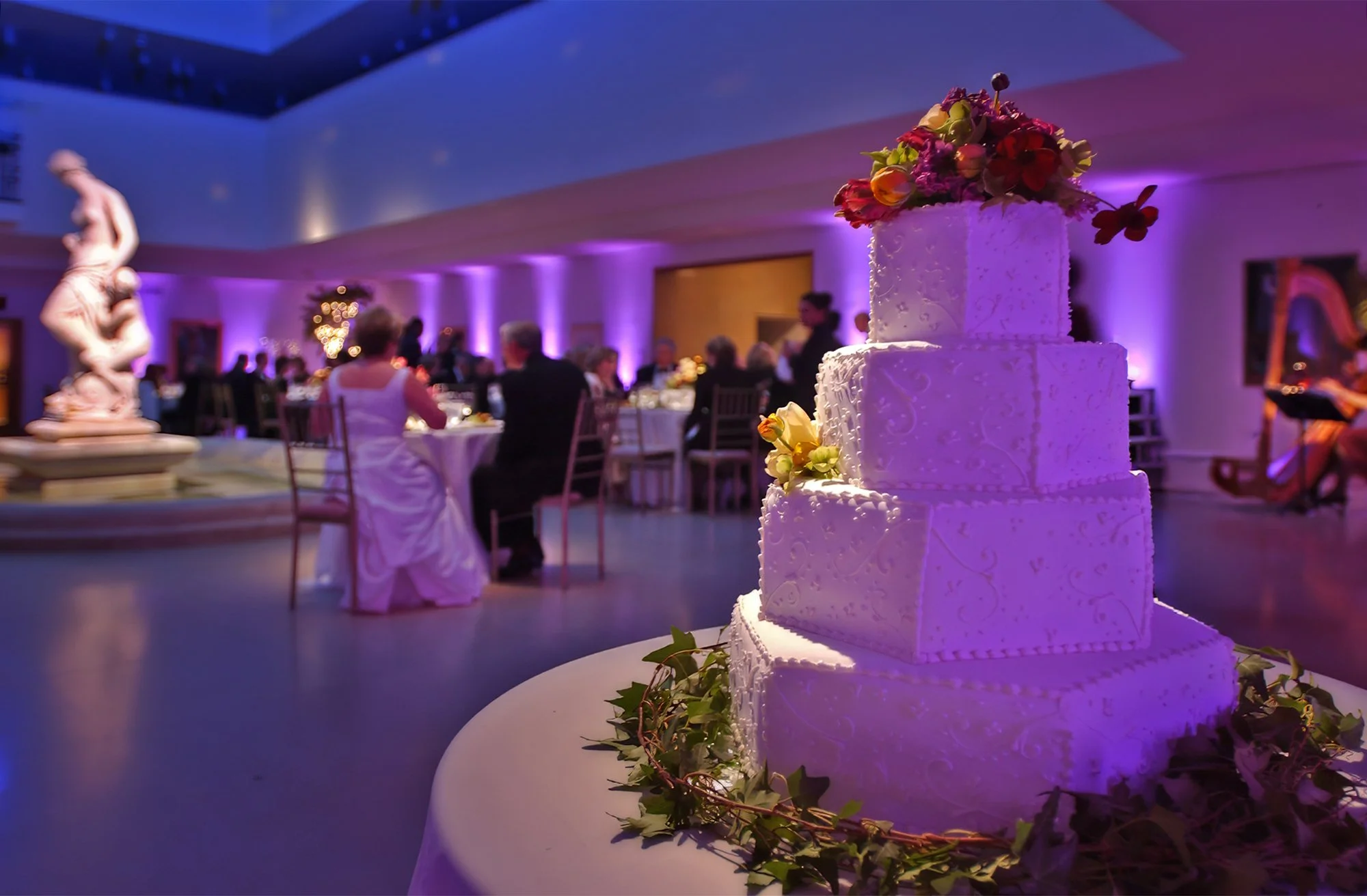 Bride and groom enjoying a candlelit wedding dinner in Avery Court at the Wadsworth Atheneum Museum of Art in Hartford CT.