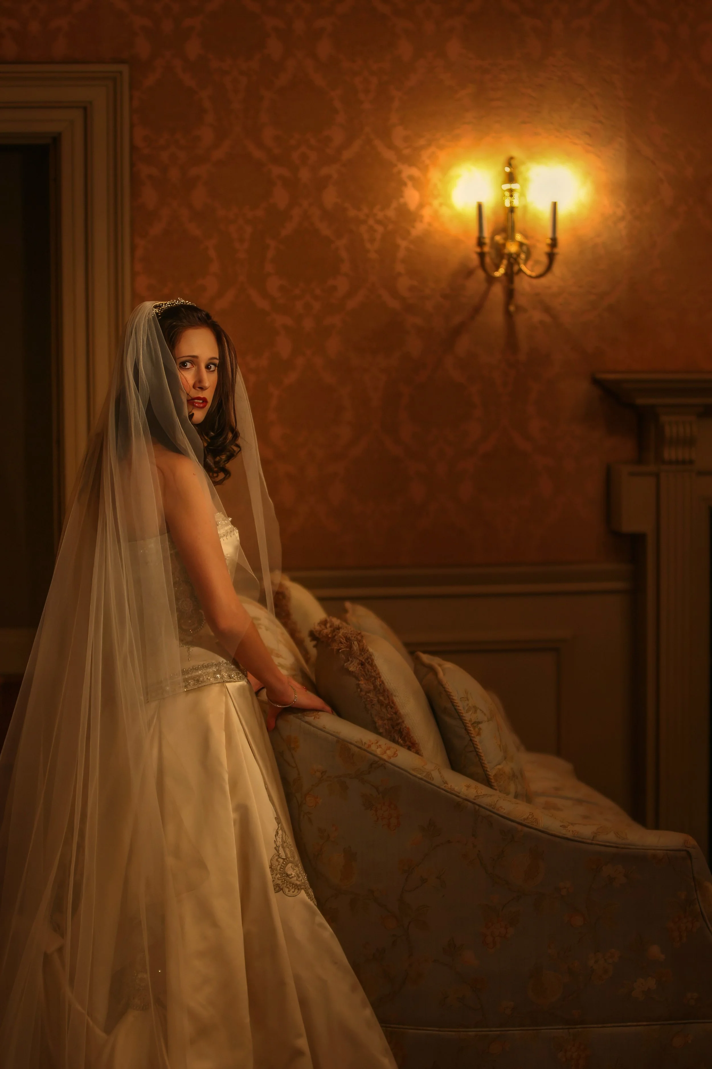 Elegant bridal portrait created in a salon at Oheka Castle during a luxury castle wedding