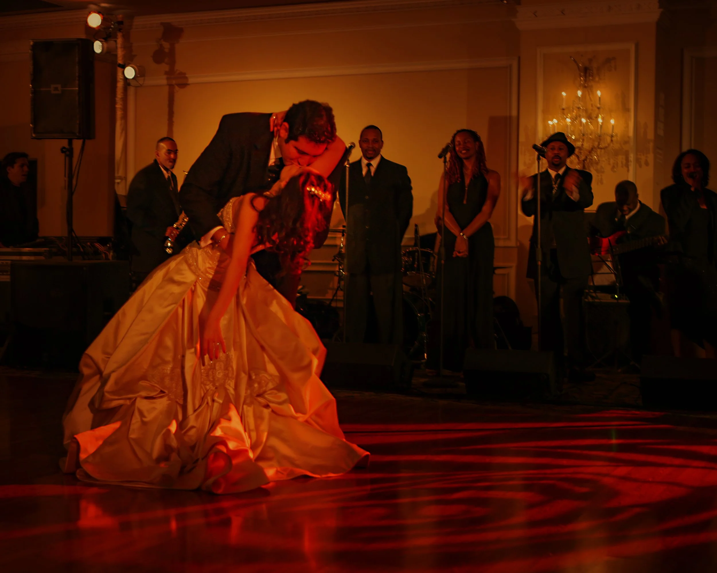 Groom Dips Bride on the Ballroom Dance Floor