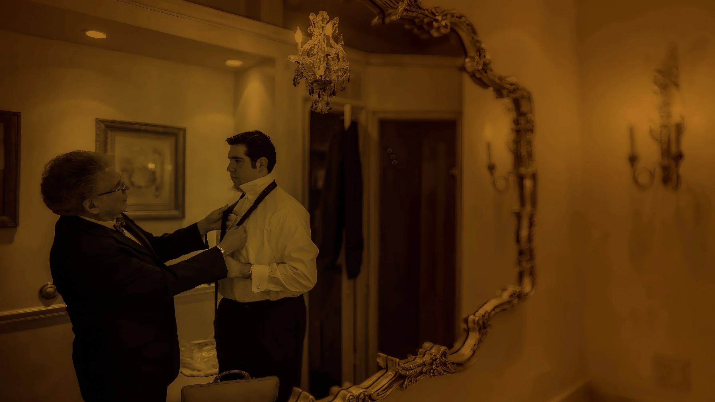 Groom Preparing with Father Before Ceremony