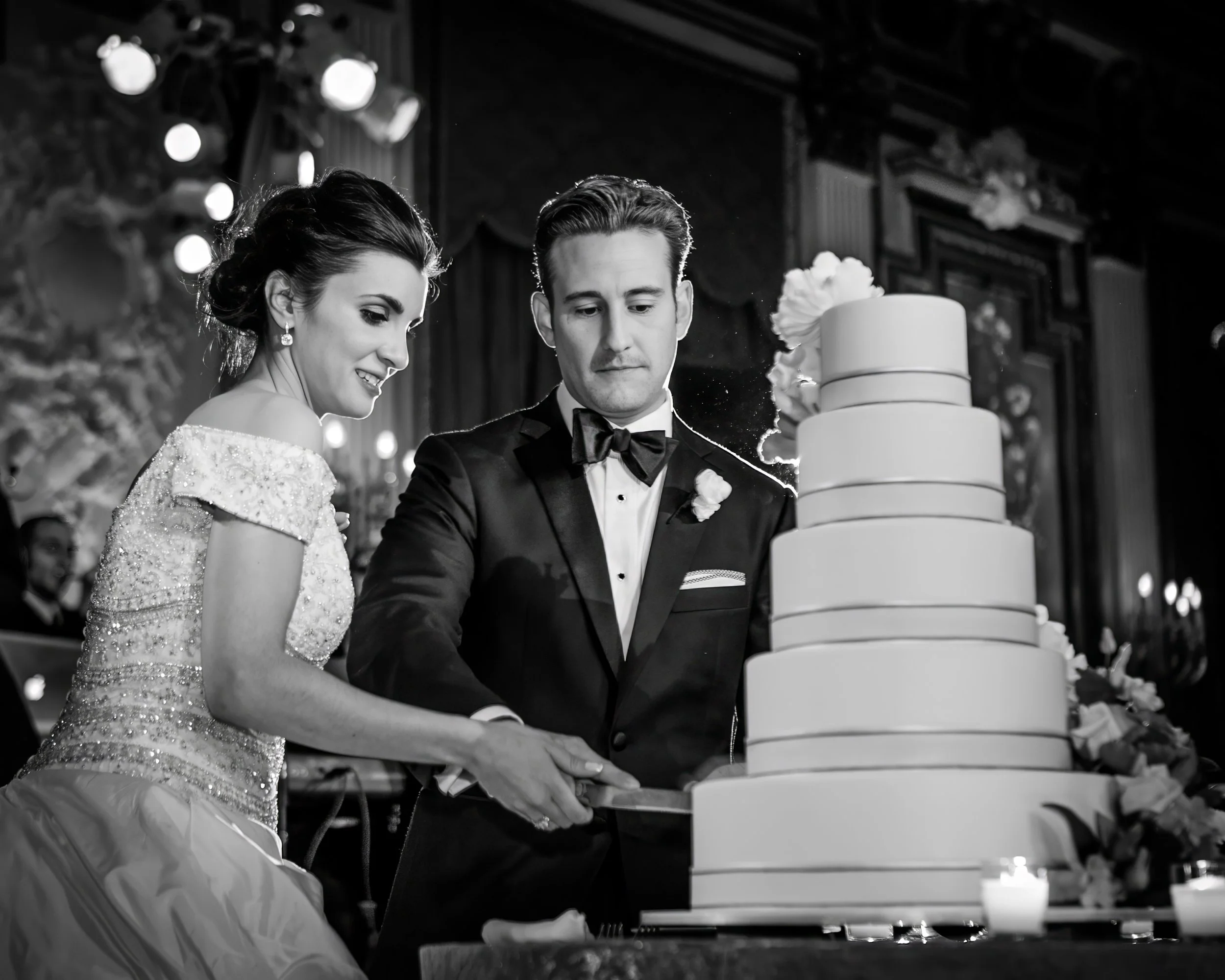 Bride and Groom Cutting Wedding Cake in Ballroom at Metropolitan Club NYC