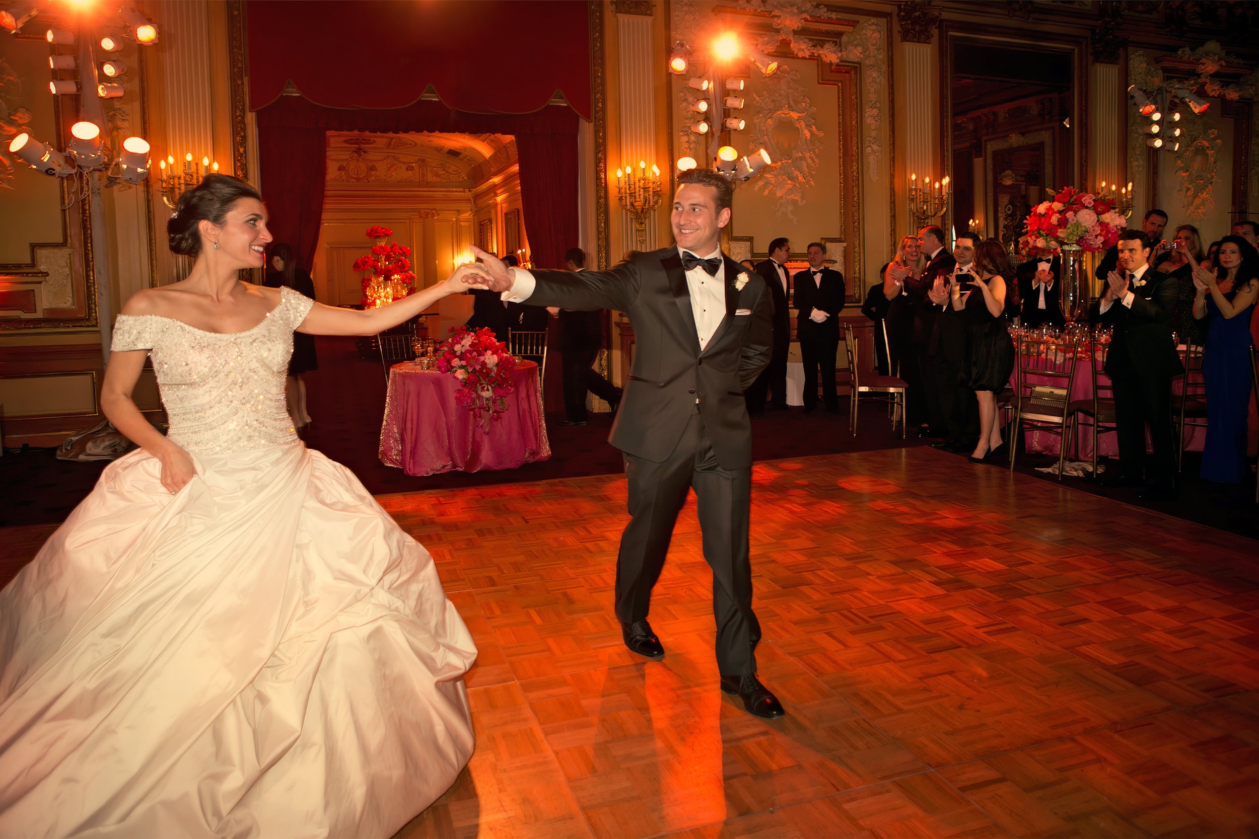 Bride and groom grand entrance into the ballroom at the Metropolitan Club New York City wedding reception